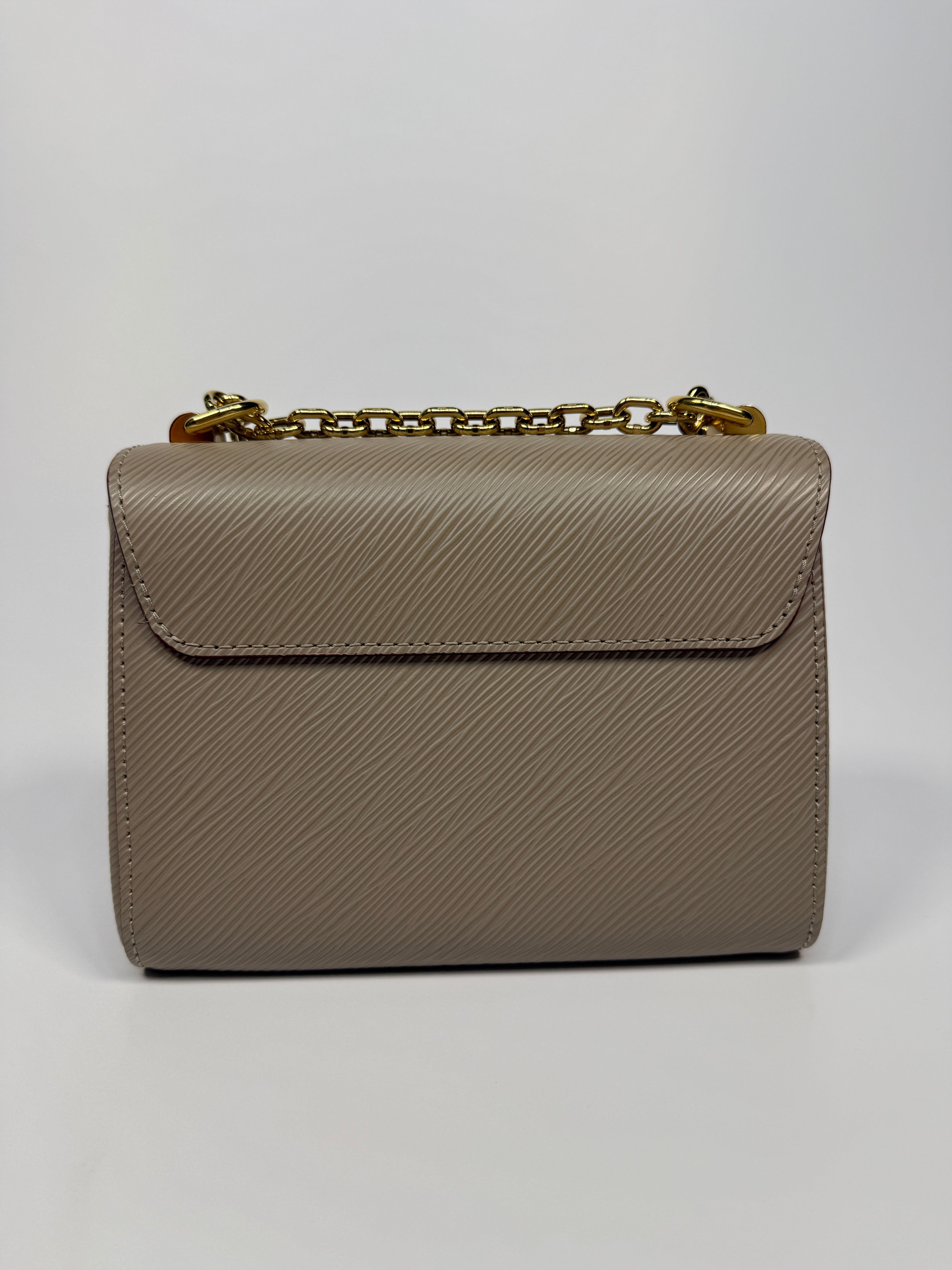 Louis Vuitton Twist PM Shoulder Bag In Beige leather with gold hardware. Authentic and pre loved excellent condition 