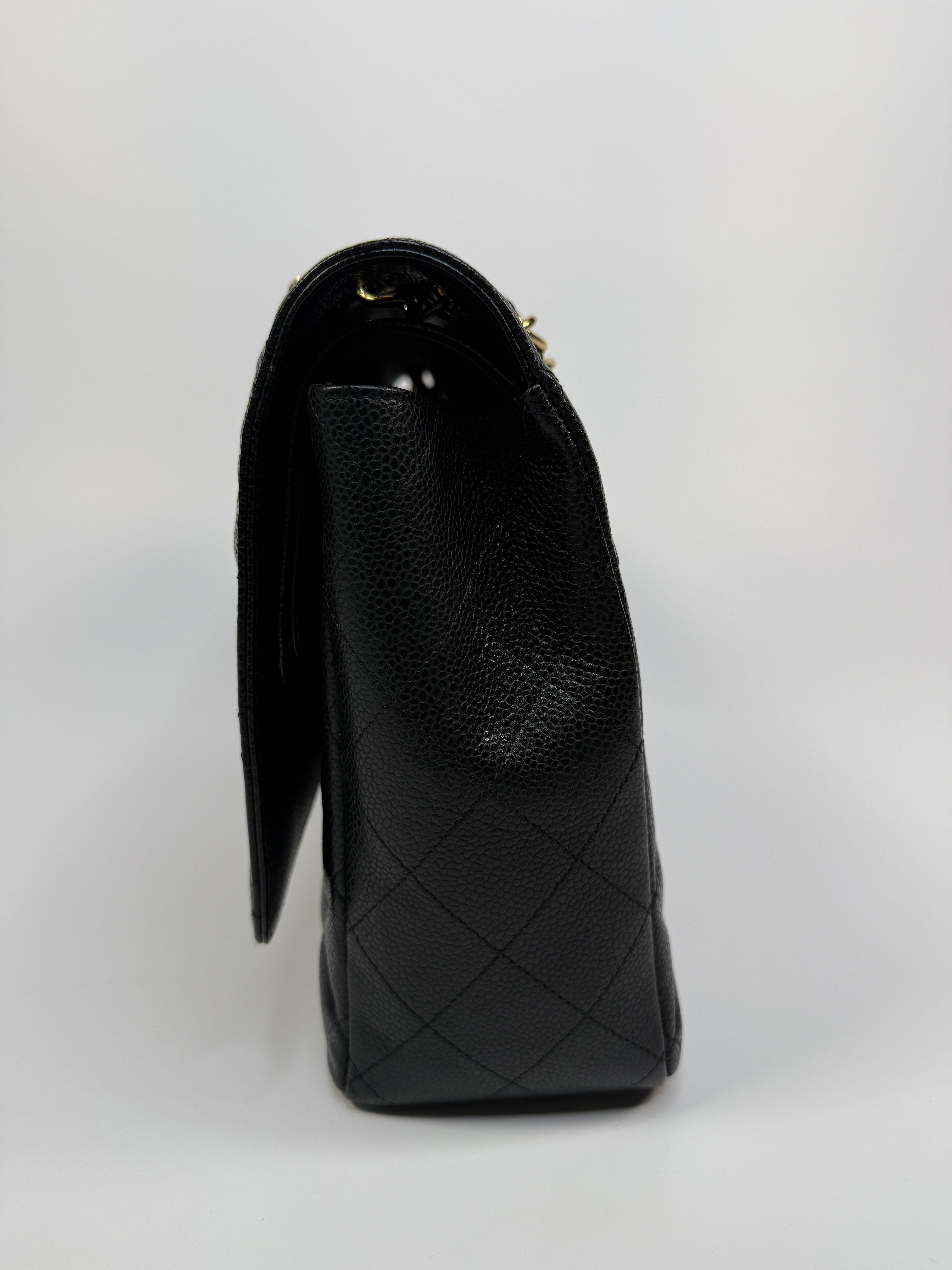 Chanel Maxi Classic Double Flap In Black Caviar Leather With Gold Hardware
Pre Loved & Authentic 