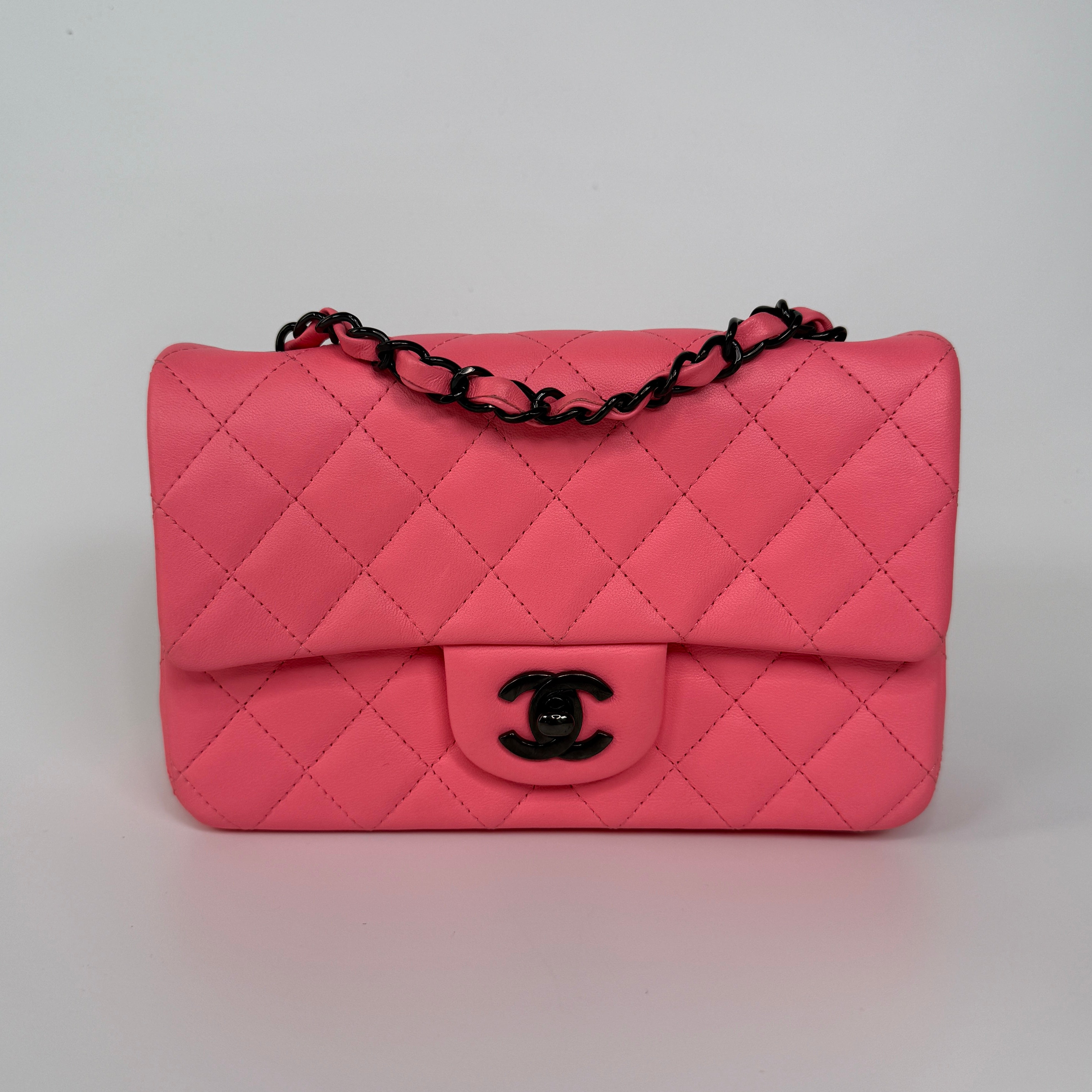 Chanel Mini Rectangle Flap Bag In Pink Lambskin With Black Hardware In Excellent Condition. Authentic and preloved. 