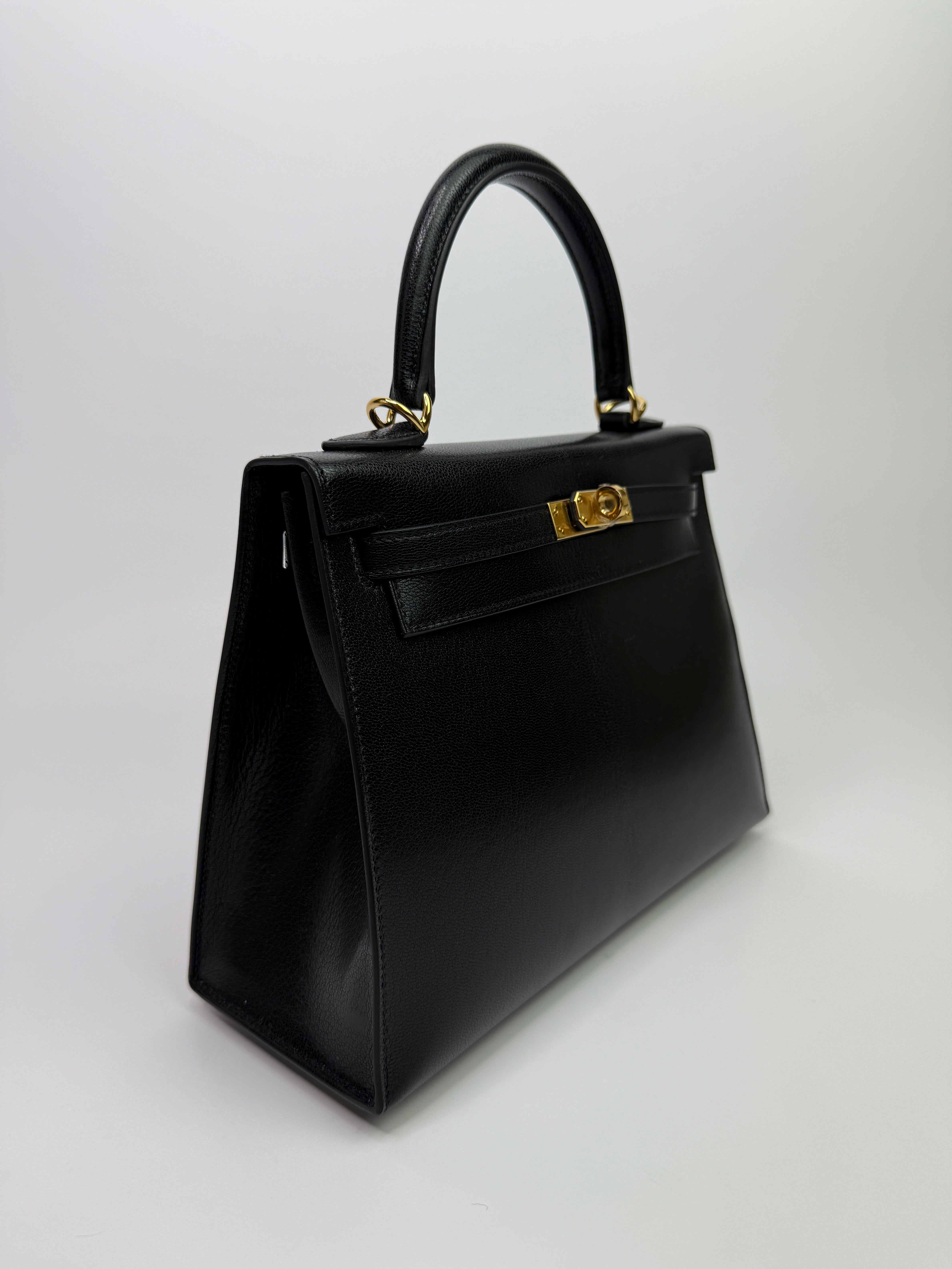 Authentic Pre Loved Hermès Kelly 25 Sellier In Black Chevre Chamilka Leather with Yellow Gold Hardware New & Unused Condition