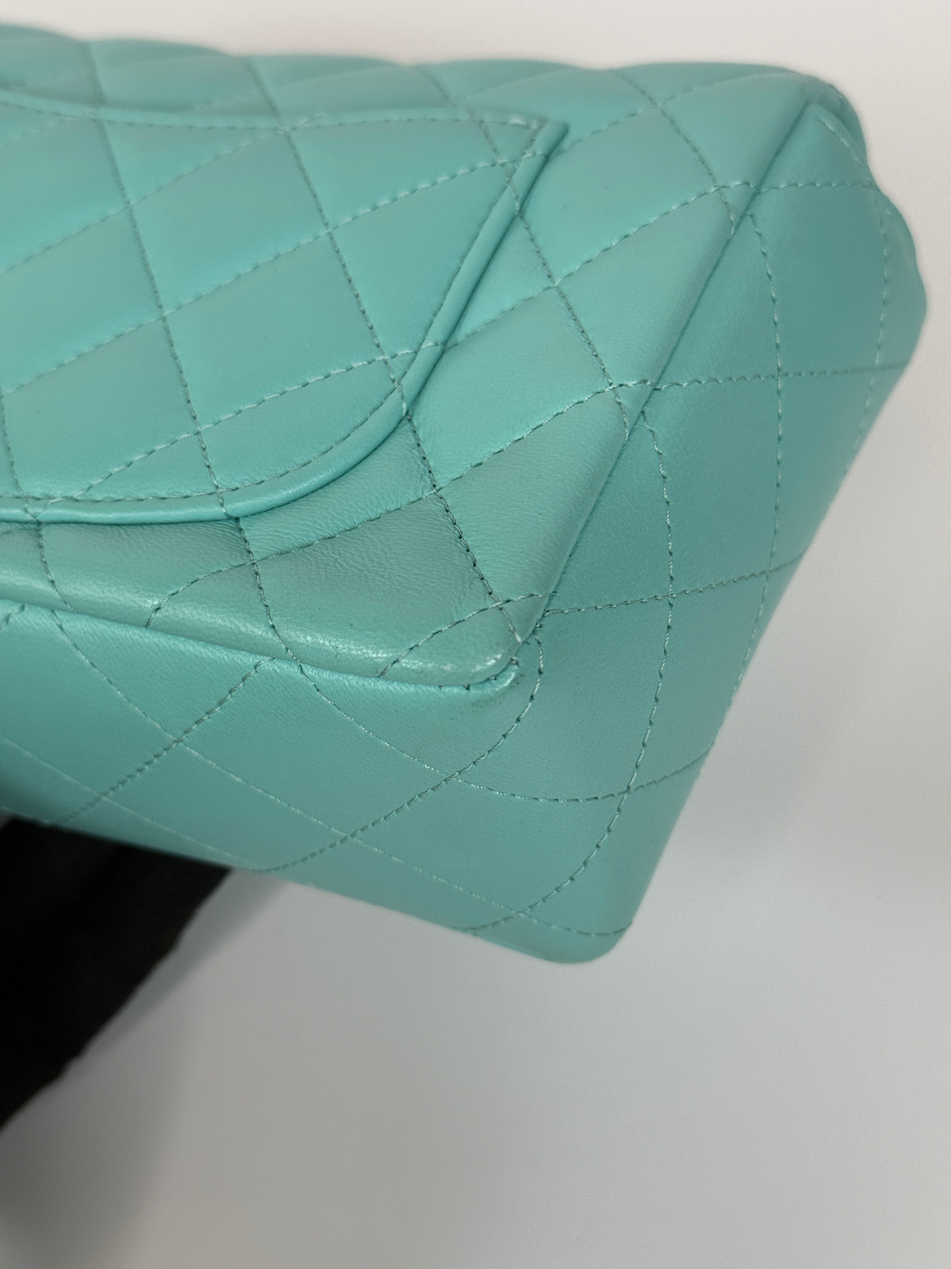 Authentic and preloved Chanel Mini Rectangle Flap Bag In Turquoise Lambskin Leather With Gunmetal Hardware In Excellent condition. Verified by Luxe Cheshire. 100% Authenticity Guarantee. 