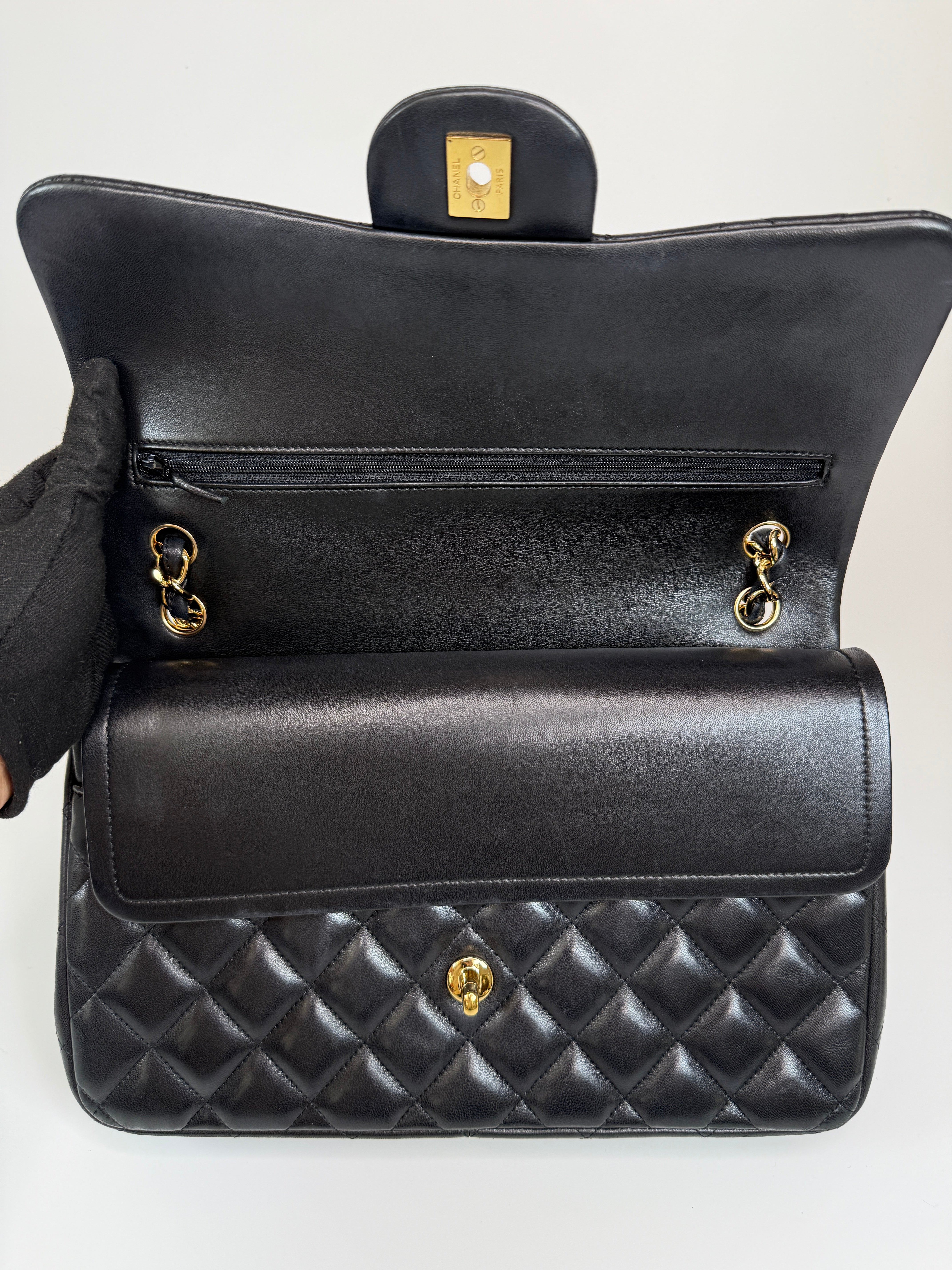 Authentic and preloved Chanel Jumbo Classic Flap Bag In Black Lambskin Leather With GOLD Hardware. Excellent condition. 100% Authenticity Guarantee 