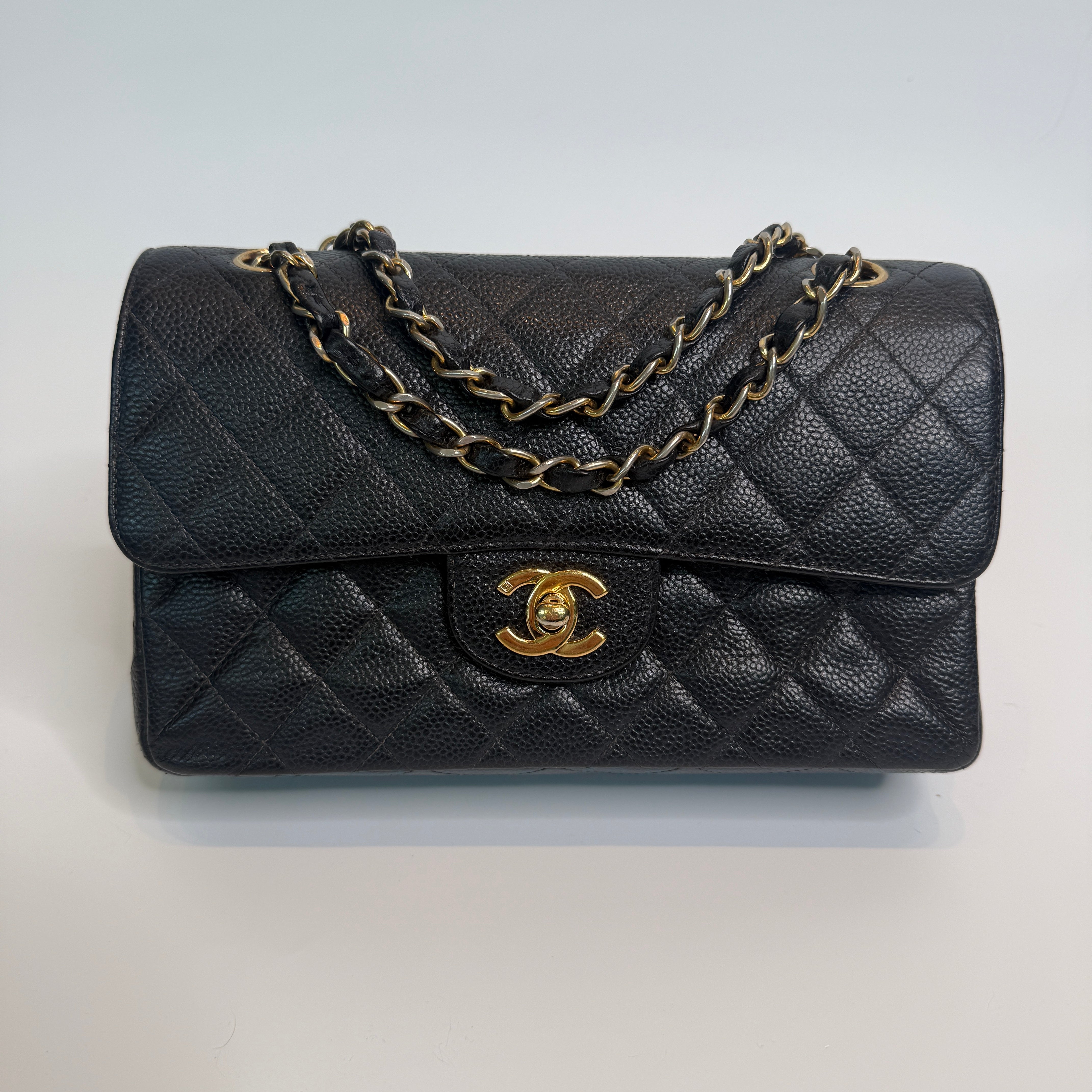 Authentic and preloved Chanel Small Vintage Classic Double Flap In Black Caviar Leather With Gold Hardware. Next day fully insured delivery. Verified by Luxe Cheshire. 100% Authenticity Guarantee. 
