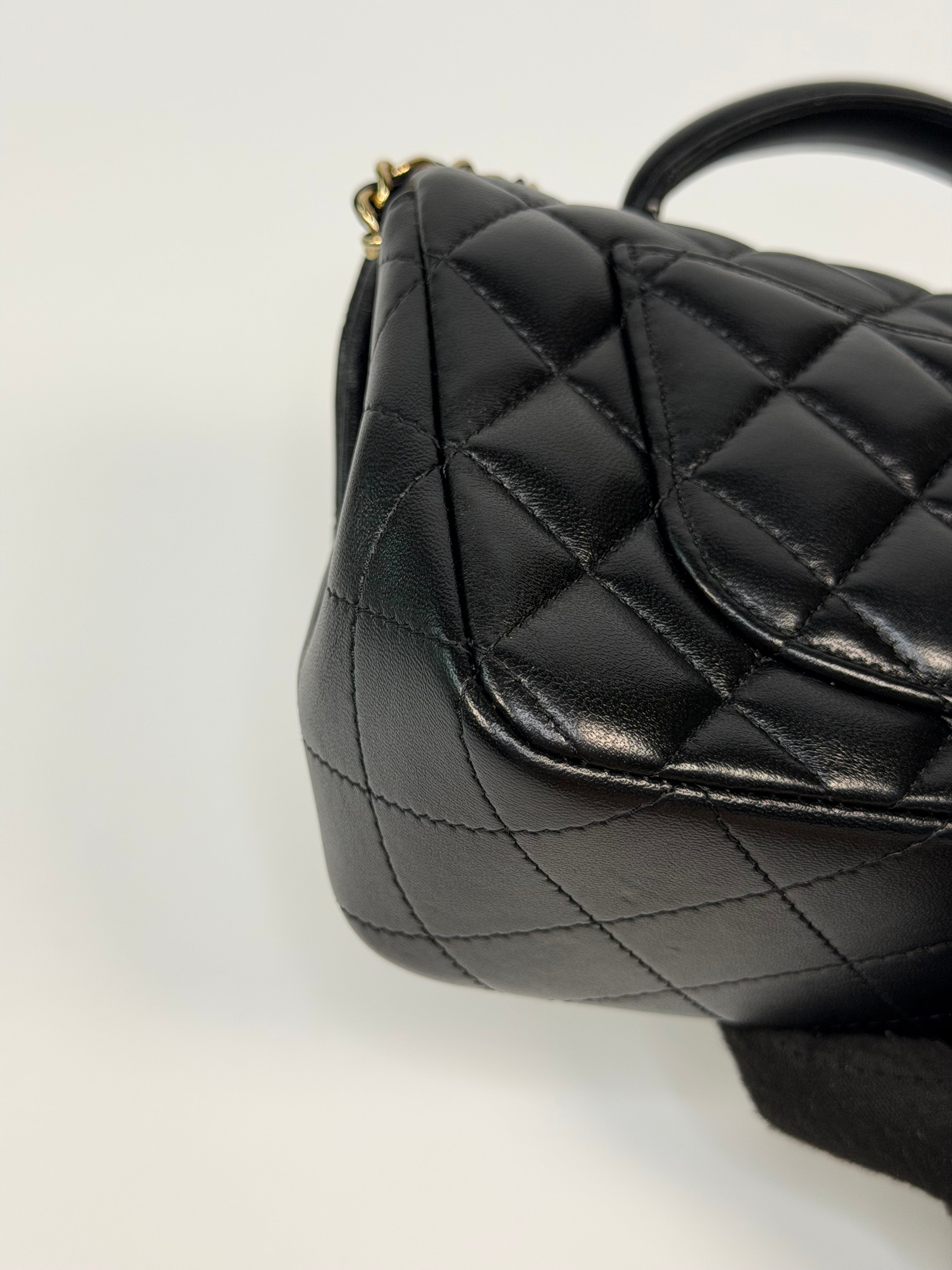 Chanel Mini Rectangle Top Handle In Black Lambskin Leather With Pale Gold Hardware. Authentic and preloved in excellent condition.
