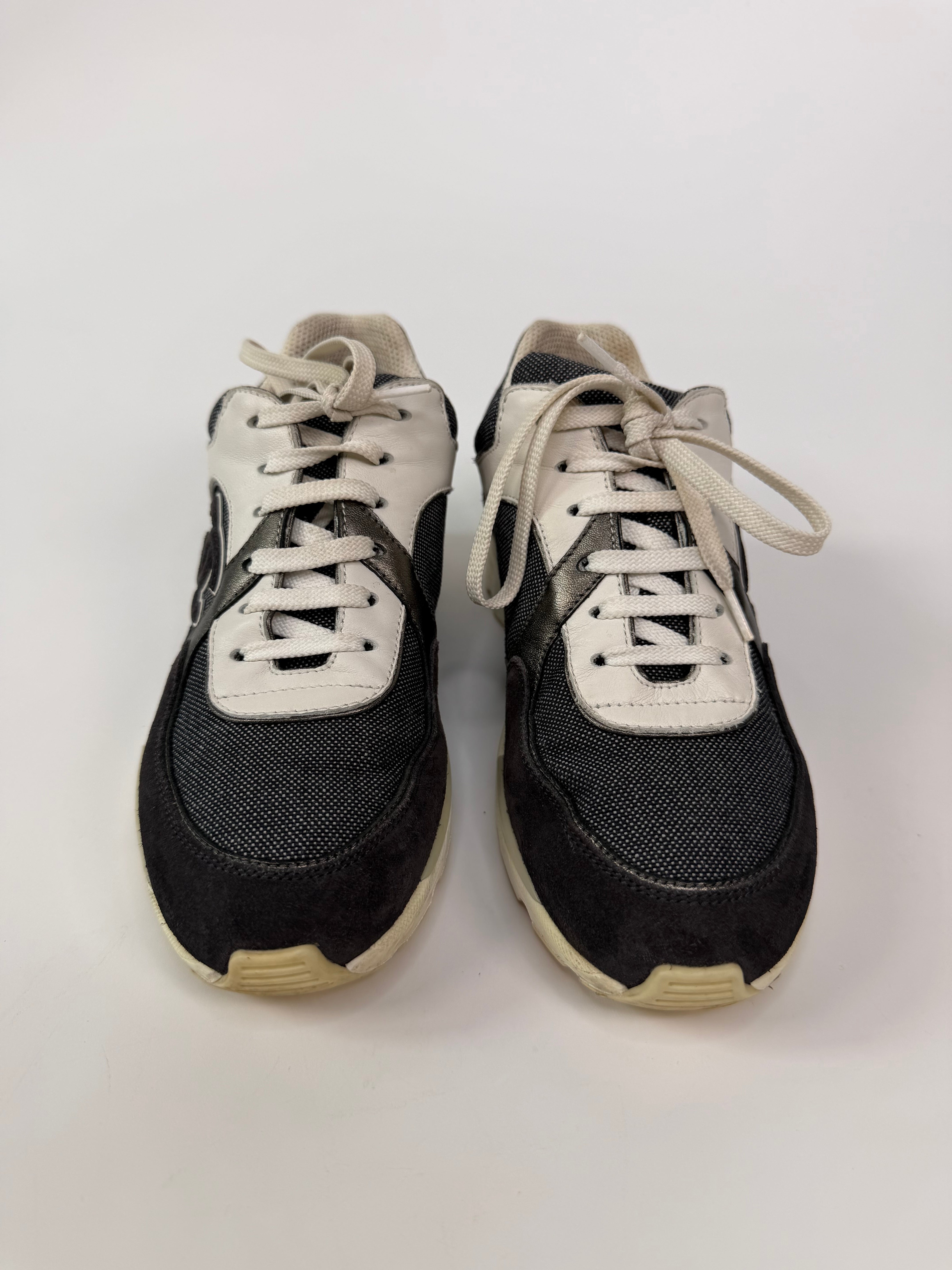 Chanel CC Sneakers In Dark Grey, White & Silver (Size 36.5/UK3.5). 100% authentic and preloved in excellent condition.
