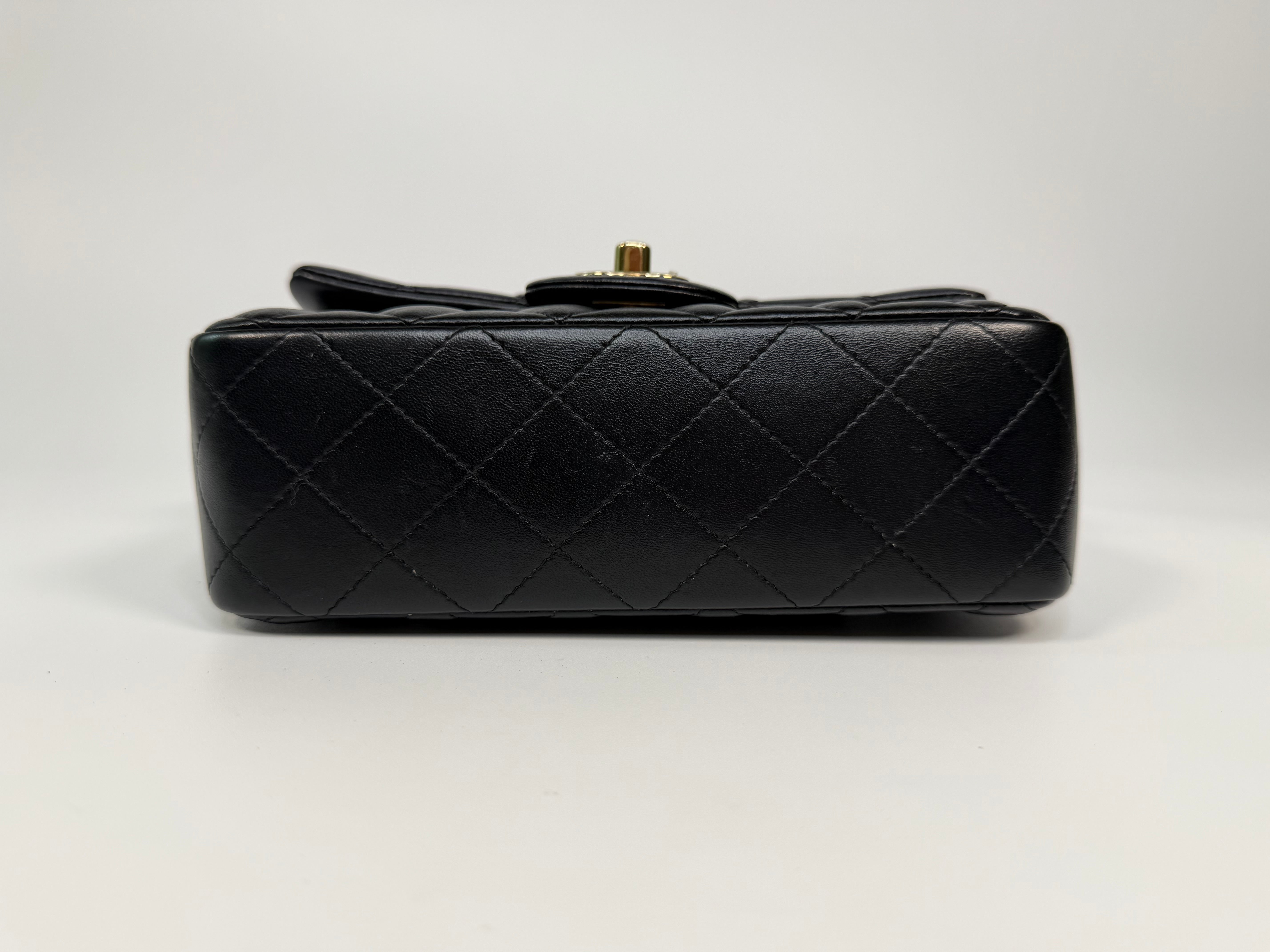 Chanel Mini Rectangle Top Handle In Black Lambskin Leather With Pale Gold Hardware. Authentic and preloved in excellent condition.