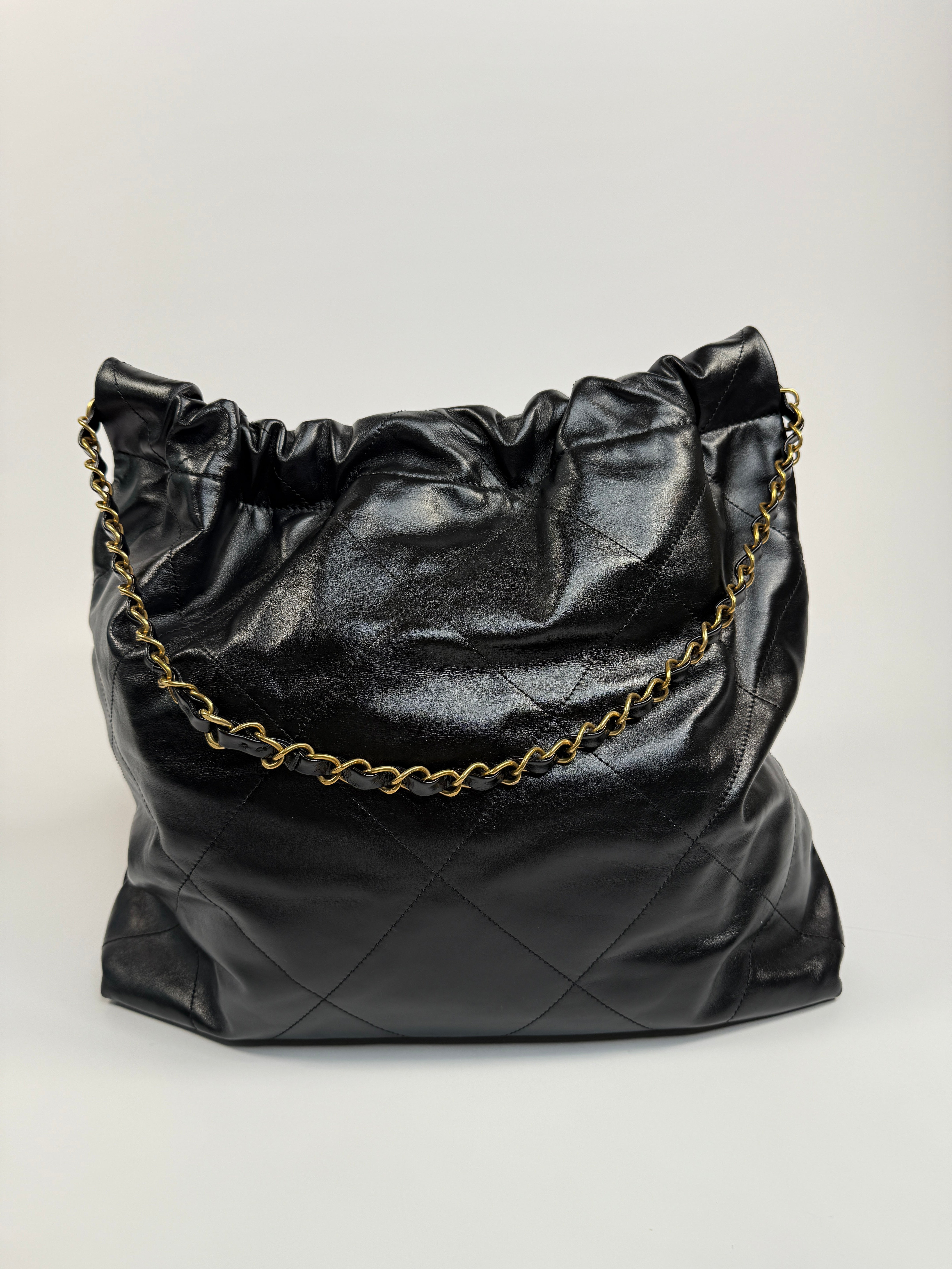Chanel 22 Handbag In Black Calfskin Leather With Gold Hardware. Excellent Condition. Authentic and Preloved