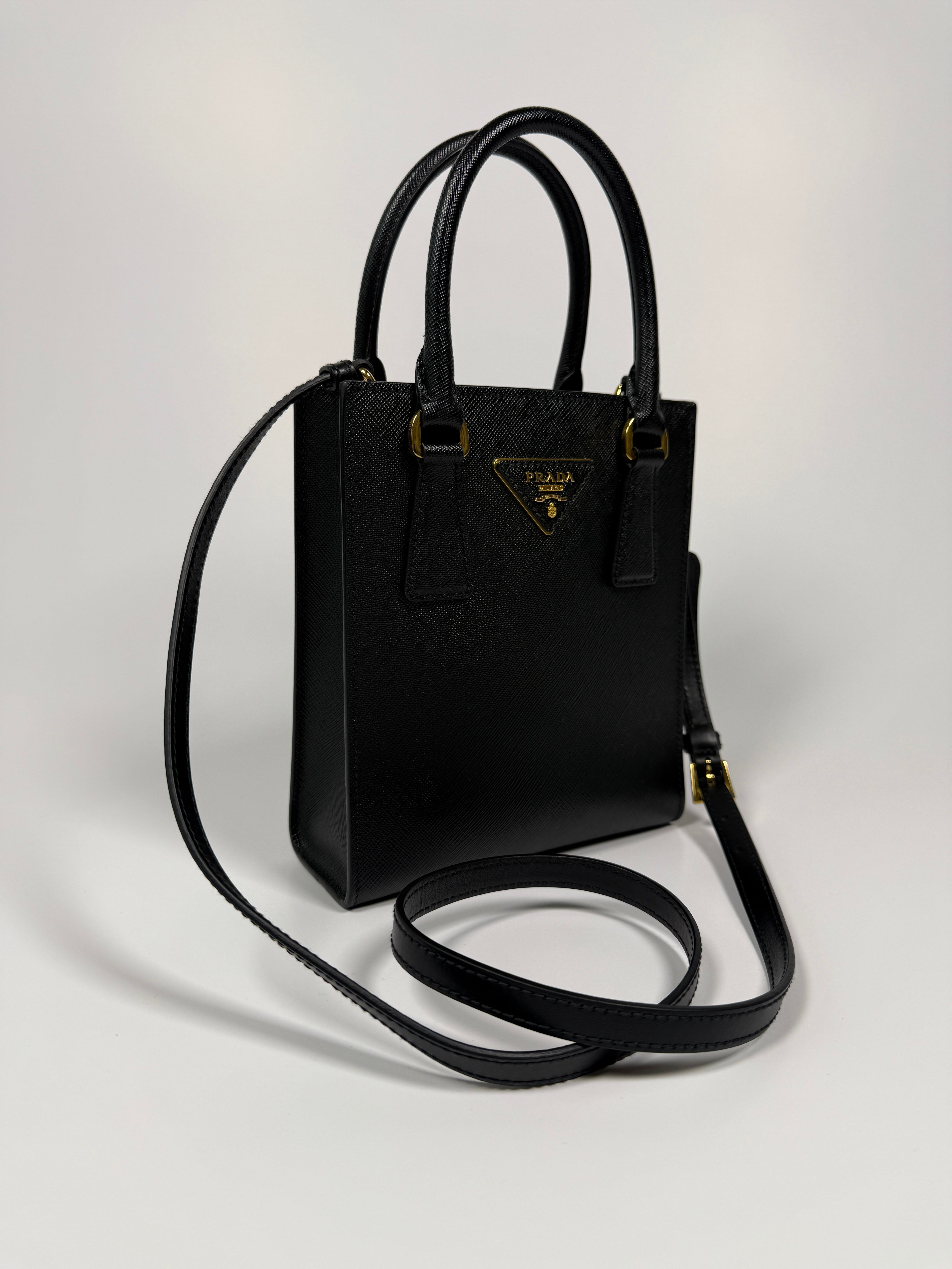 Prada Mini Tote In Black Saffiano Leather With Gold Hardware. 100% Authentic and preloved in excellent condition
