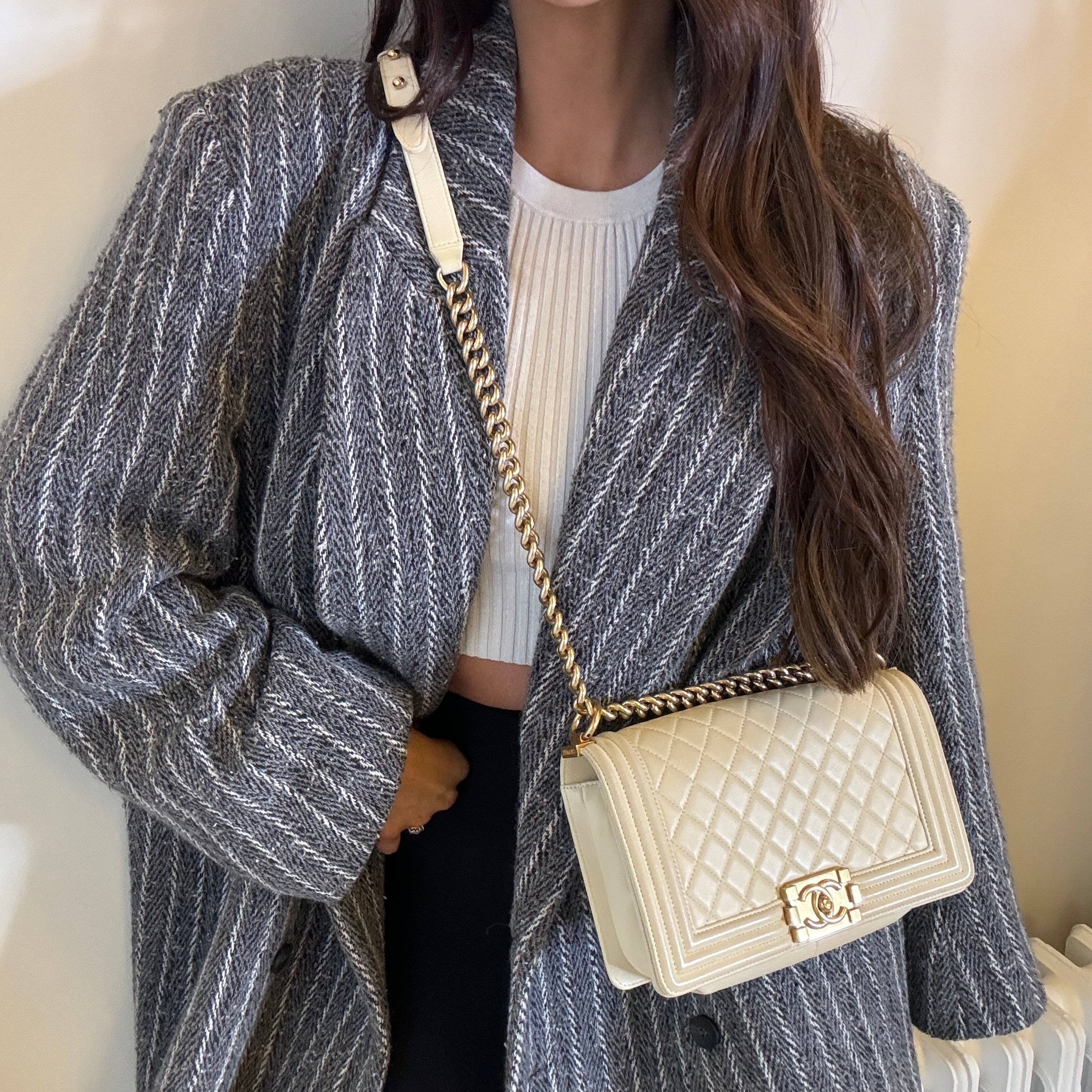 Authentic pre-loved Chanel Boy Bag Medium In Cream Lambskin With Gold Hardware. 