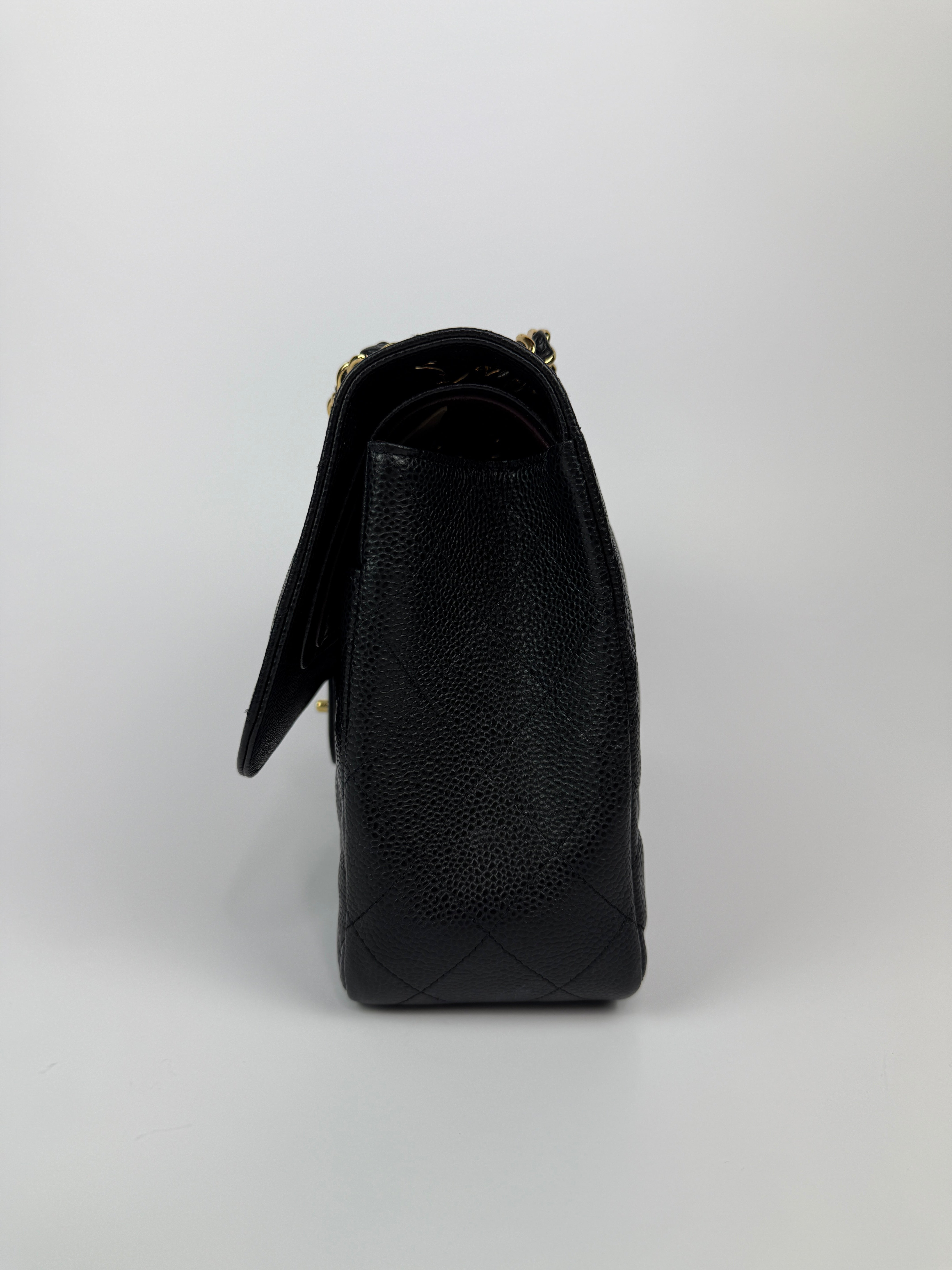 Chanel Jumbo Classic Double Flap In Black Caviar Gold Hardware
Pre Loved & Authentic 