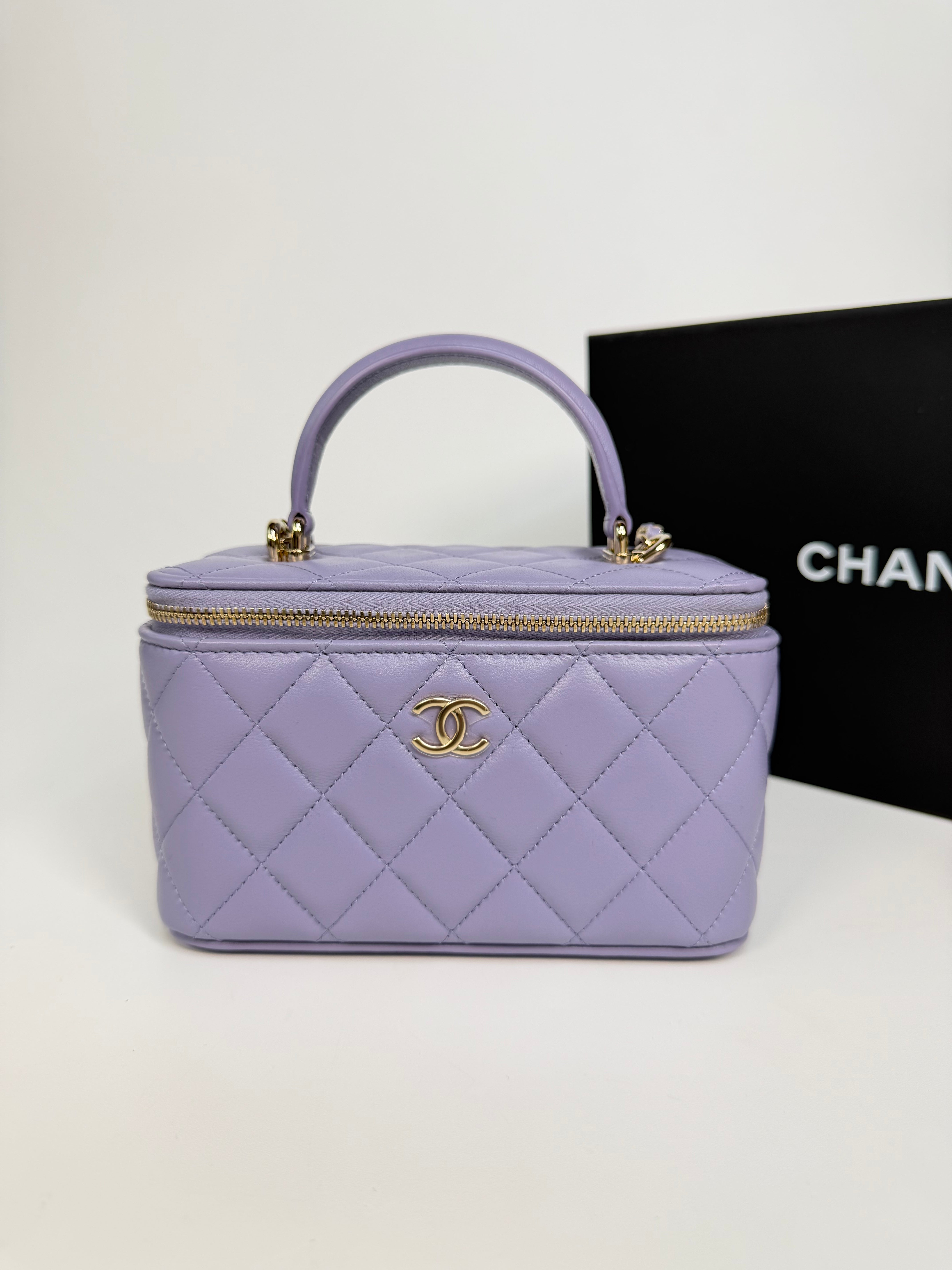 Chanel Mini Vanity Top Handle In Lilac Lambskin Leather With Gold Hardware. Authentic and preloved in excellent condition