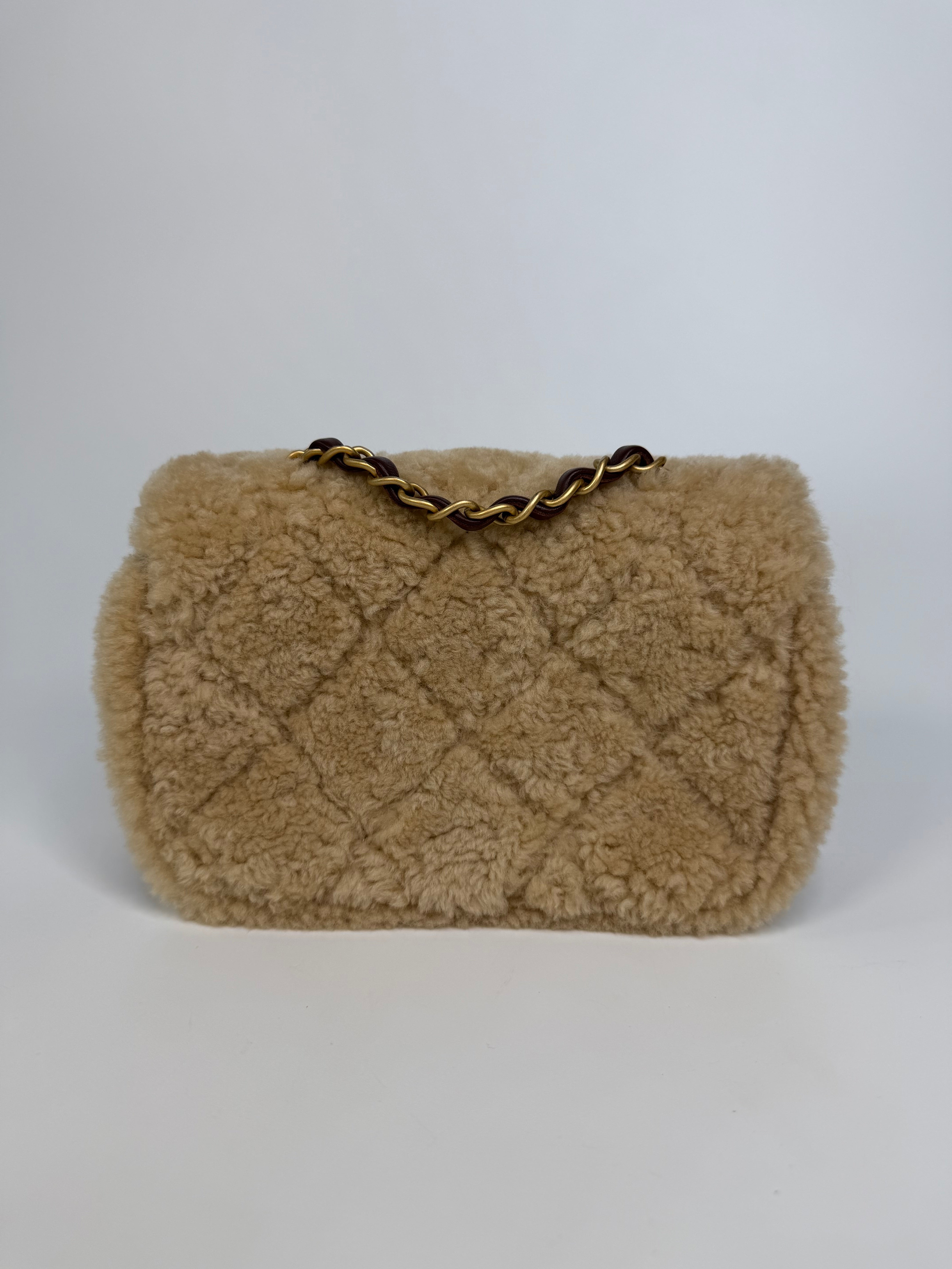 Chanel Mini Rectangle In Brown Lambskin Leather & Shearling With Gold Hardware. Authentic and preloved in excellent condition with 100% authenticity guarantee.