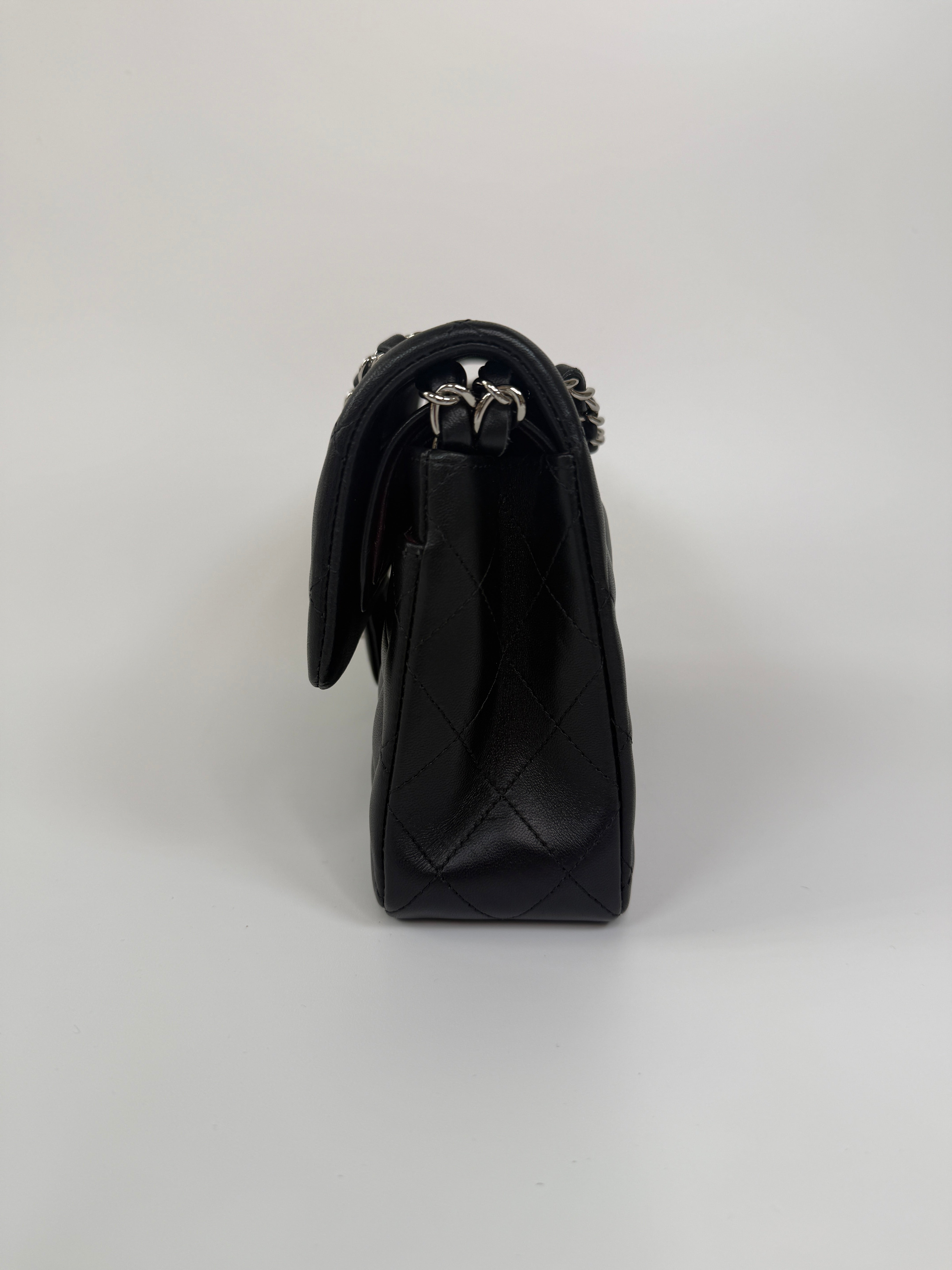 Chanel Small Classic Double Flap In Black Lambskin Leather With Silver Hardware Authentic and preloved in excellent condition. 100% Authenticity guarantee