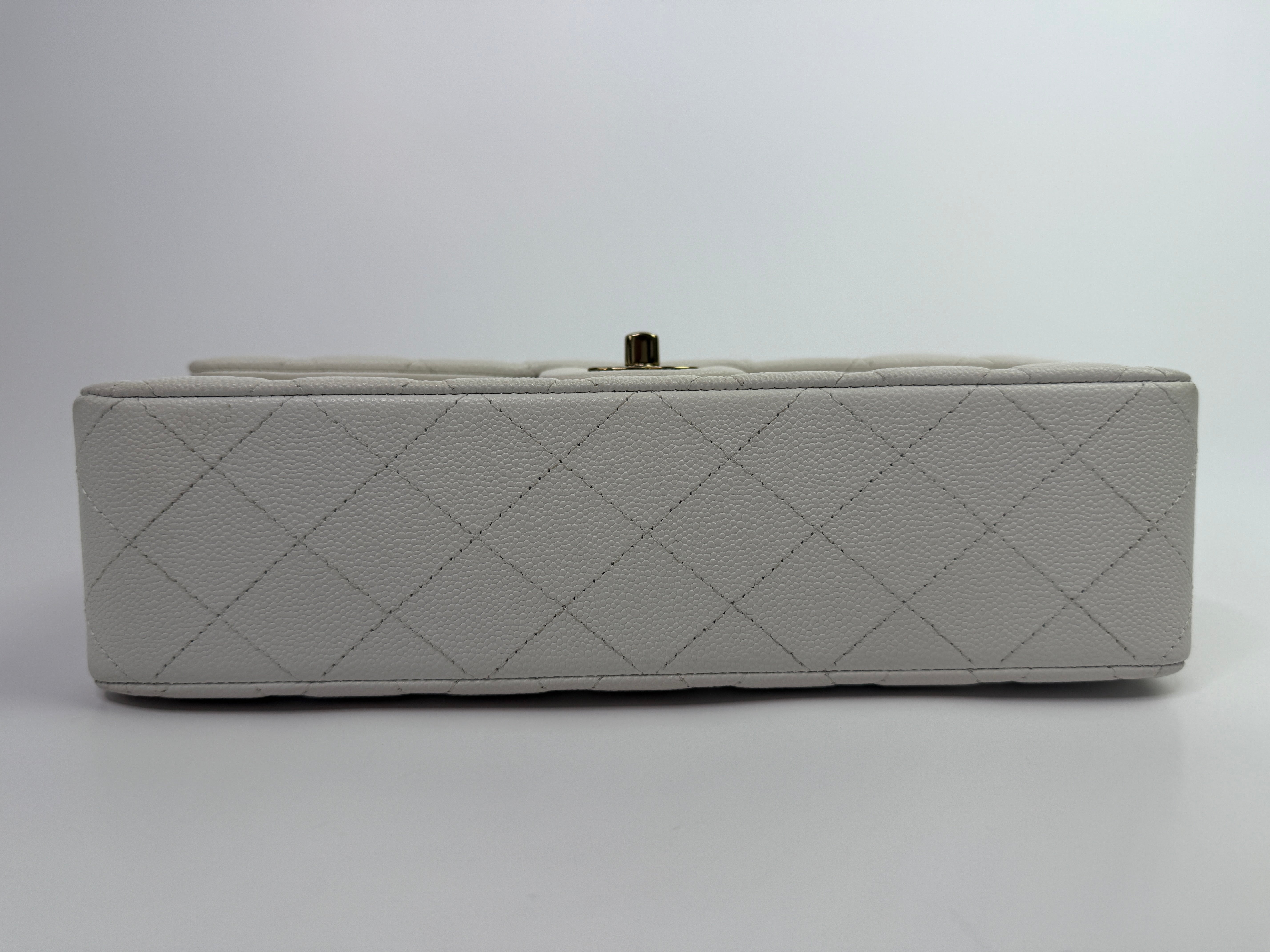 Authentic pre-loved Chanel Medium Classic Double Flap White Caviar Leather With Gold Hardware. 