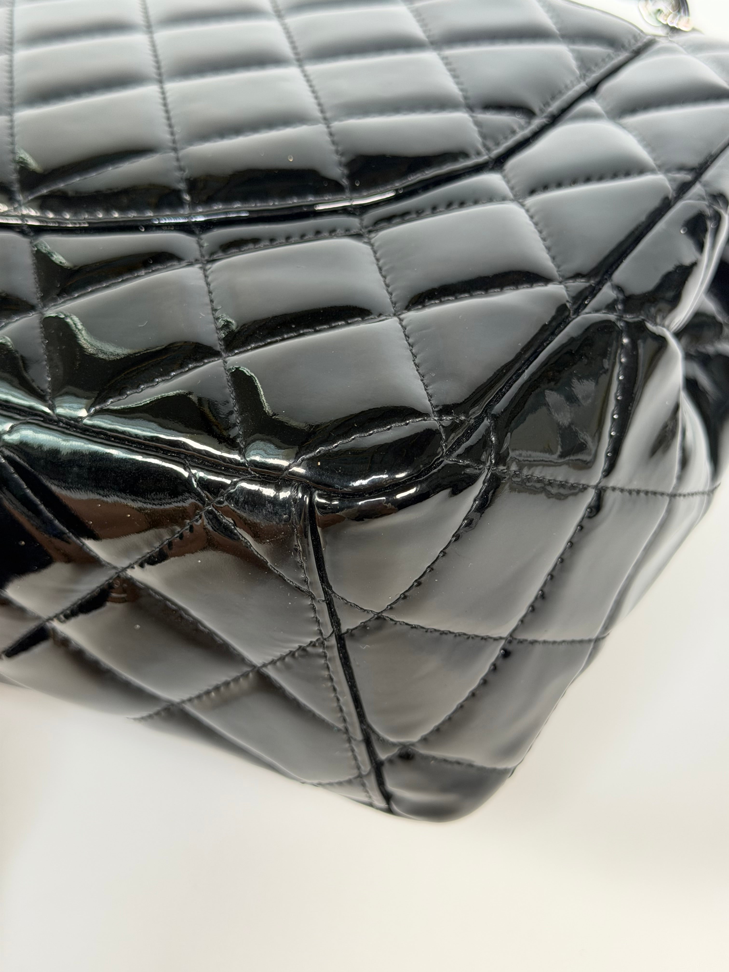 Chanel Maxi Classic Double Flap In Black Patent Leather With Silver Hardware. 100% authentic and preloved in excellent condition.