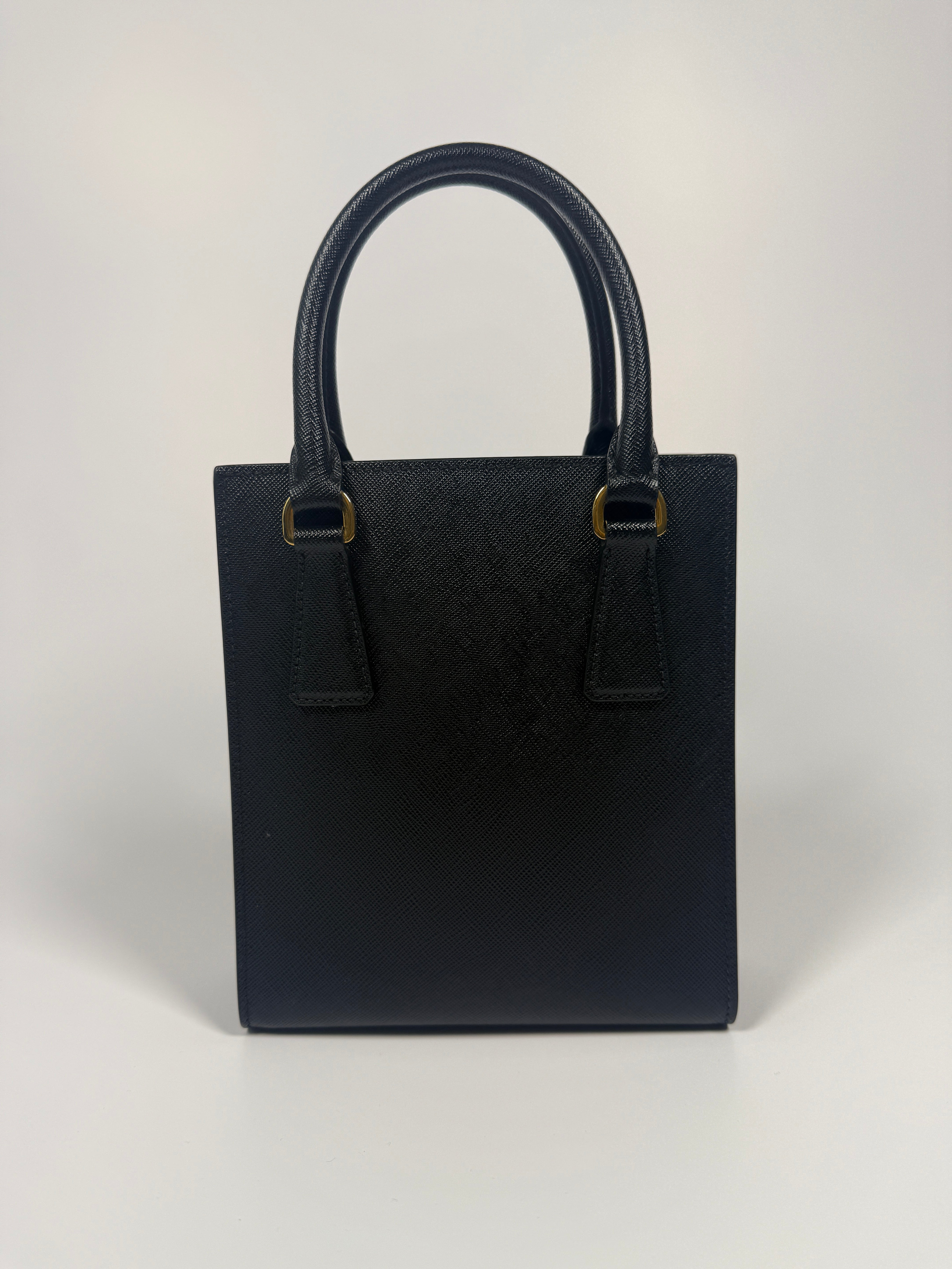 Prada Mini Tote In Black Saffiano Leather With Gold Hardware. 100% Authentic and preloved in excellent condition