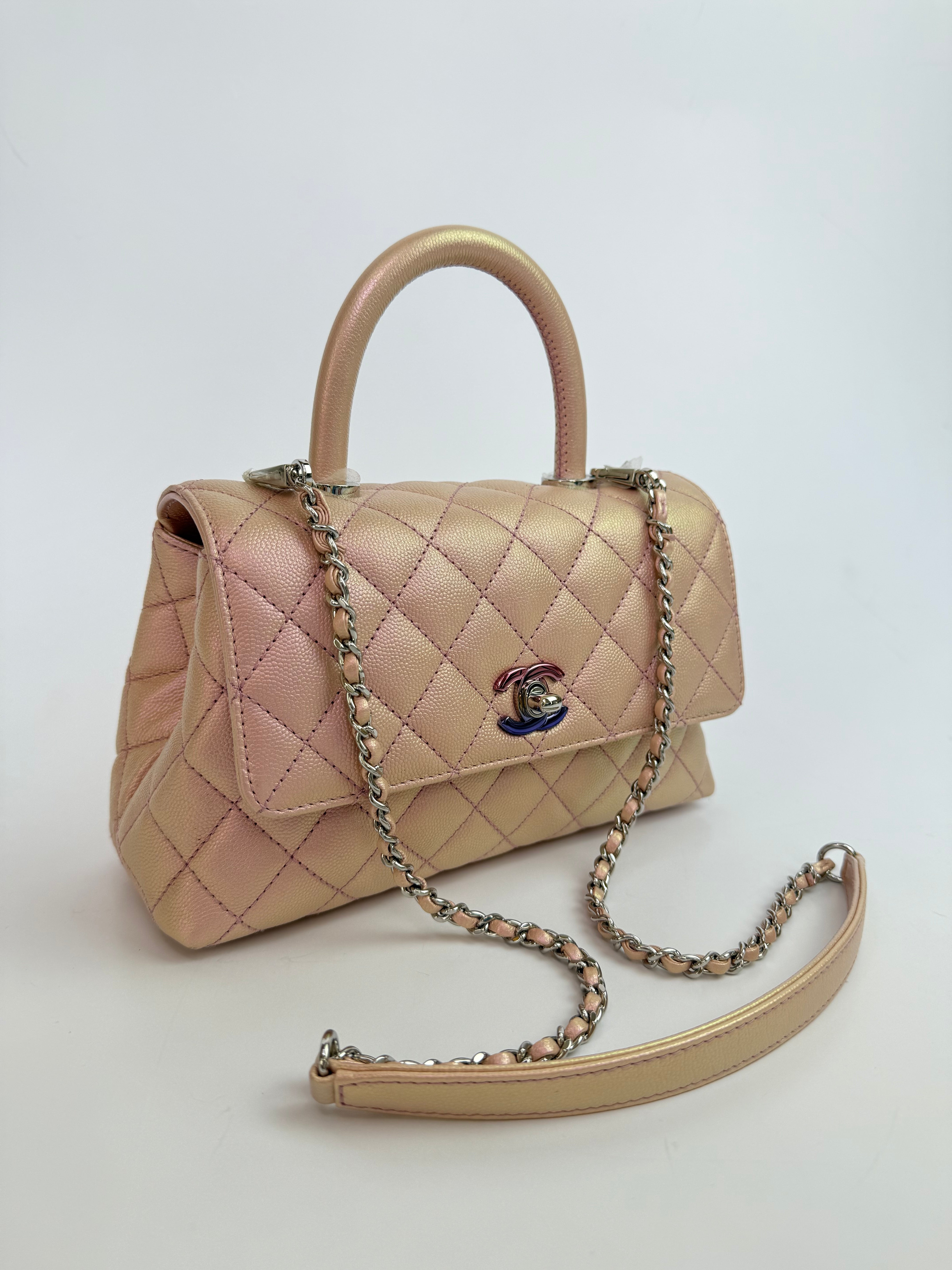 Authentic pre-loved Chanel Small Coco In Iridescent Pink Caviar With Rainbow Hardware. 