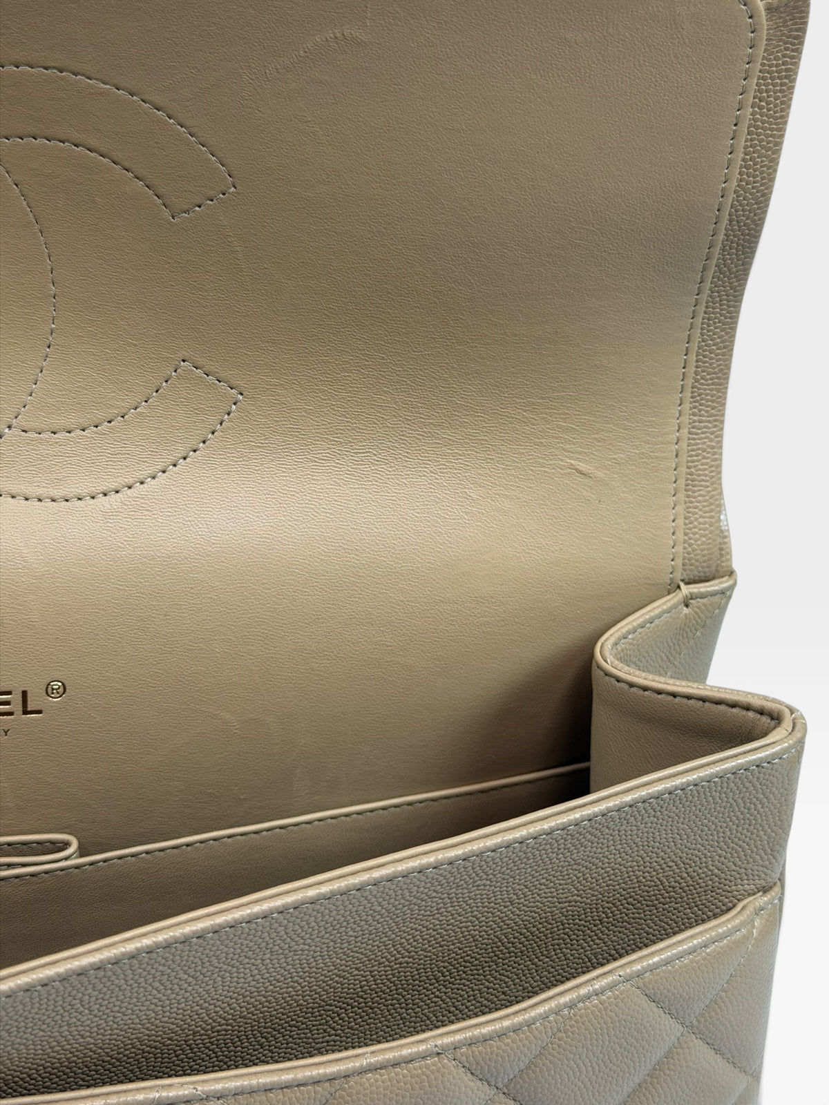 Chanel Maxi Flap In Beige Caviar Leather With Gold Hardware. 100% authentic and pre loved in excellent condition. 