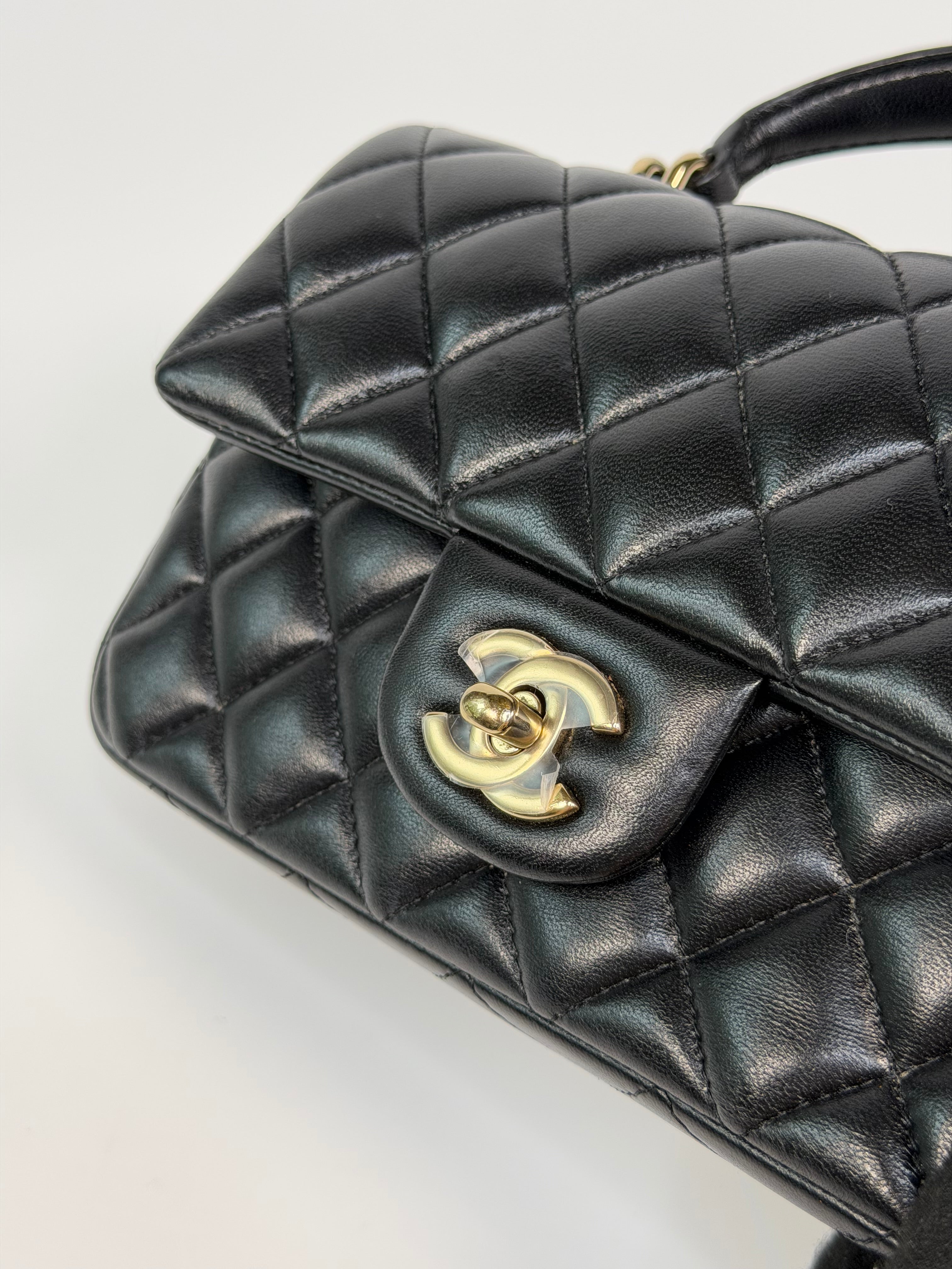 Chanel Mini Rectangle Top Handle In Black Lambskin Leather With Pale Gold Hardware. Authentic and preloved in excellent condition.