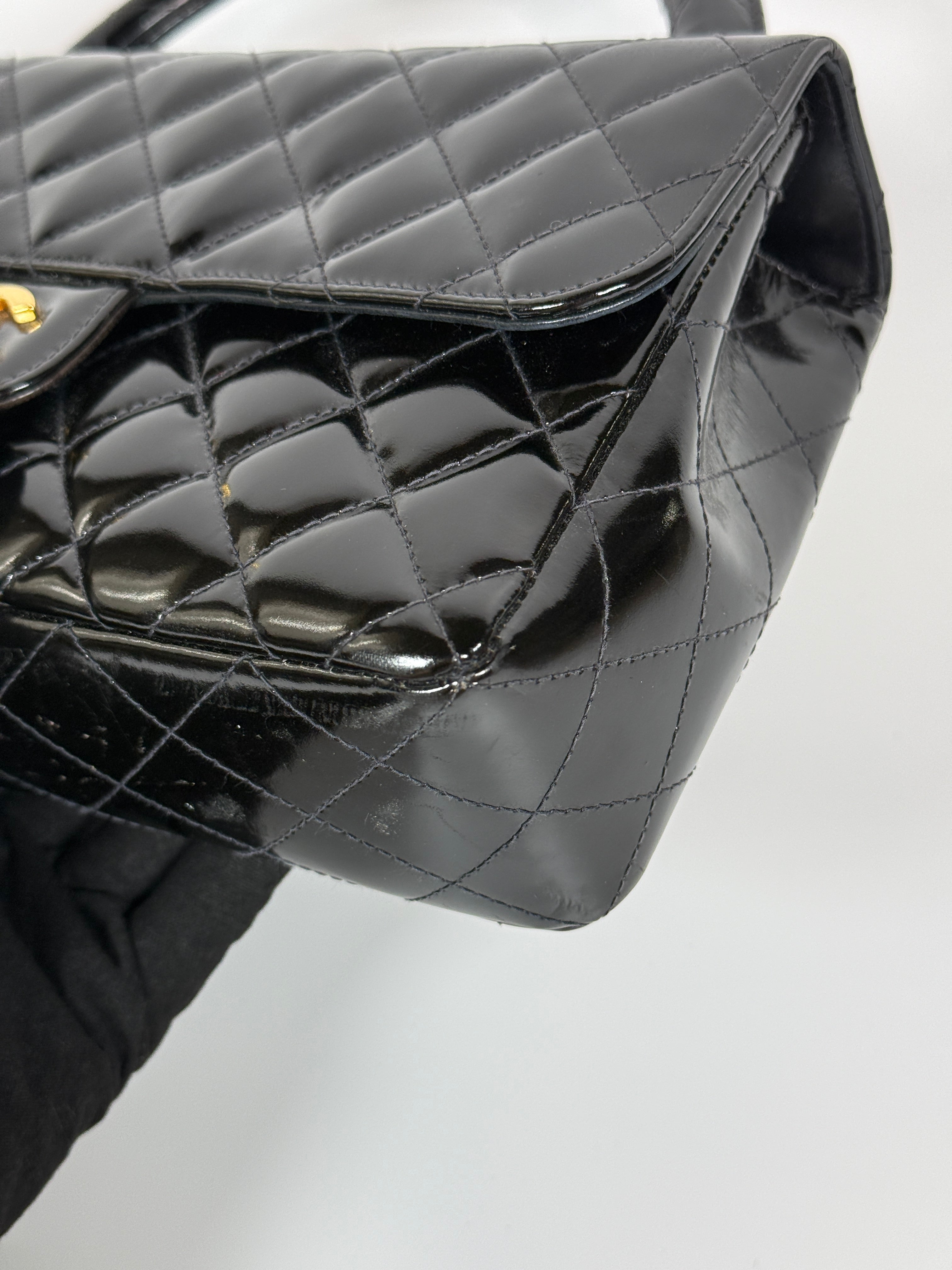 Authentic and preloved Chanel Vintage Kelly Top Handle Bag In Black Patent Leather With 24kt Gold Hardware. Very Good condition. 100% Authenticity guarantee 