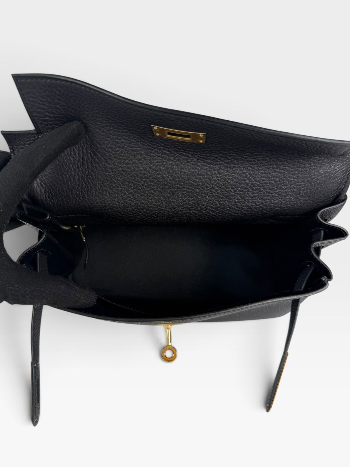 Authentic pre-loved Hermès Kelly 28 In Black Togo Leather Gold Hardware. New and Unused condition, verified by Luxe Cheshire. Trusted designer resale.