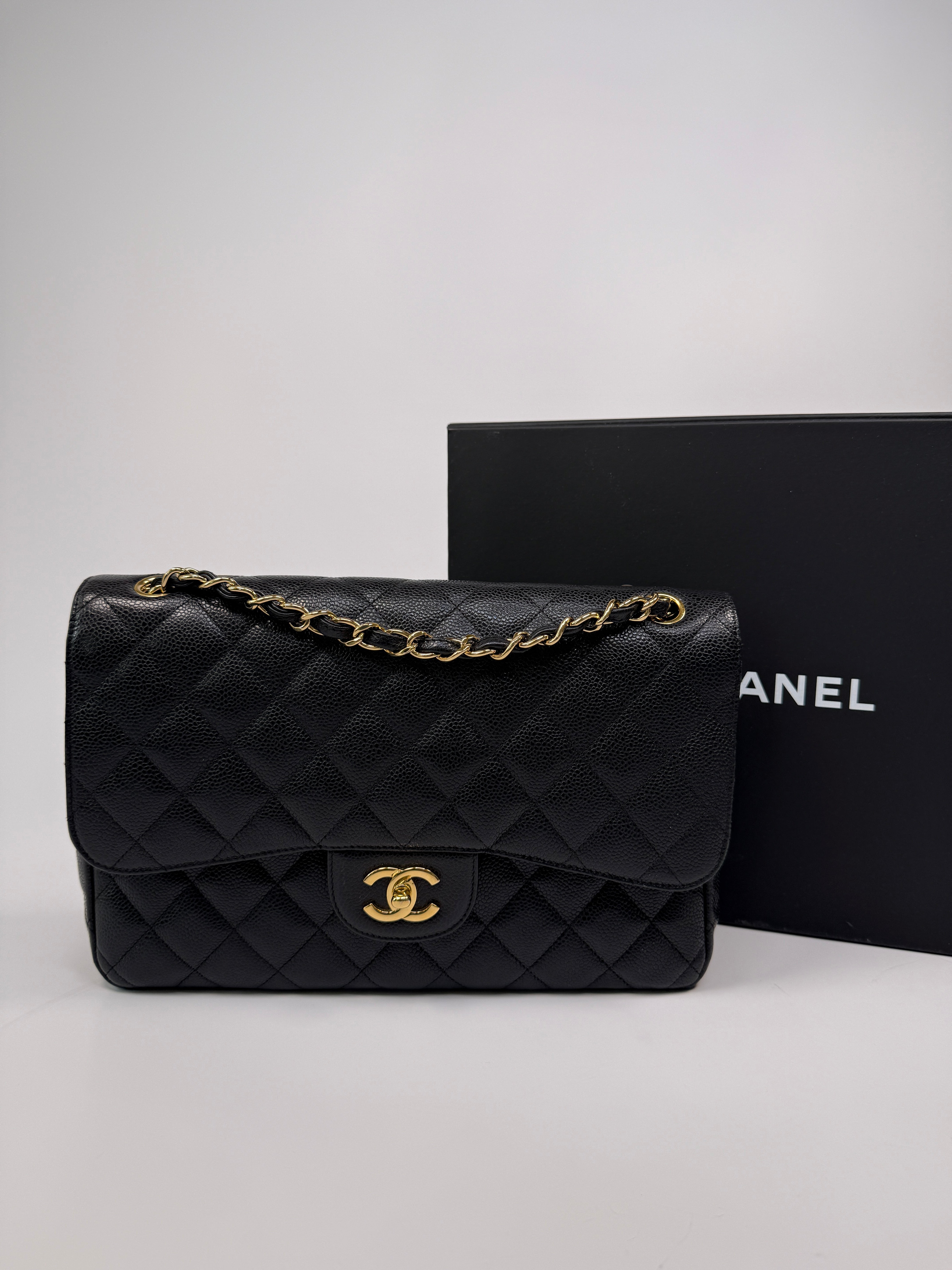 Chanel Classic Jumbo Flap Bag In Black Caviar LeatherWith Gold Hardware
Pre Loved & Authentic 