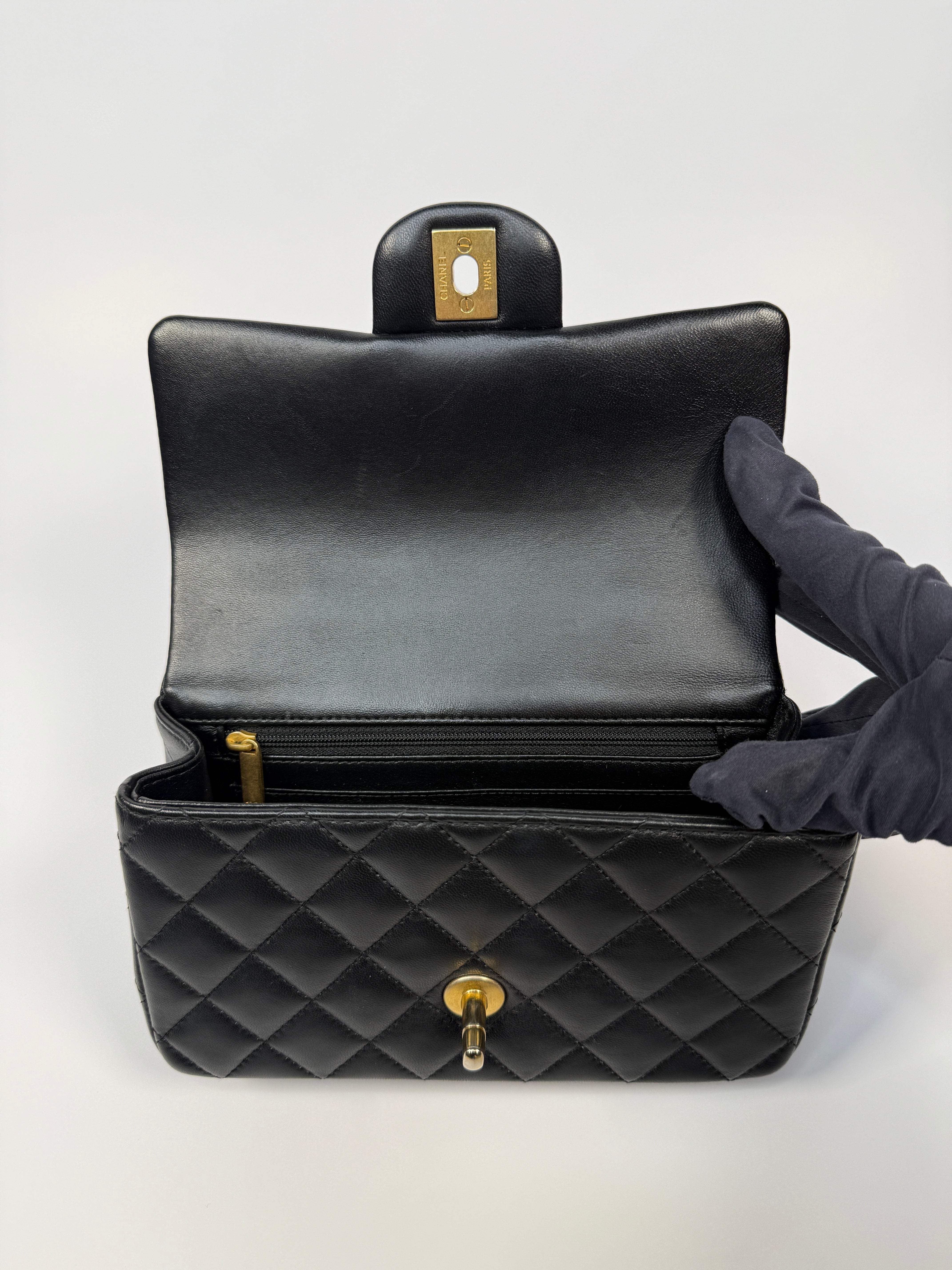 Chanel Mini Rectangle Top Handle Flap Bag In Black Lambskin With Gold Hardware
Pre Loved & Authentic 