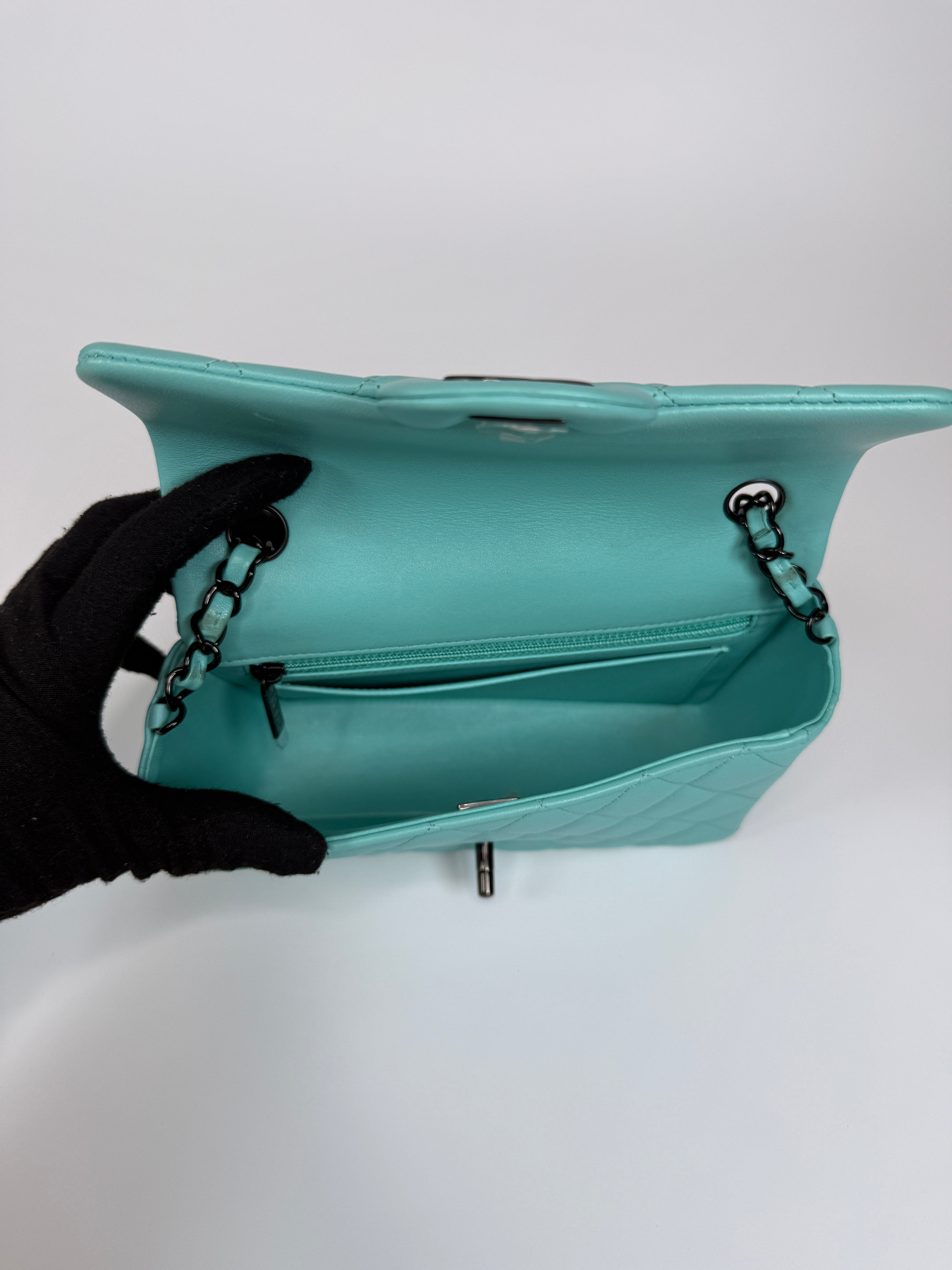 Authentic and preloved Chanel Mini Rectangle Flap Bag In Turquoise Lambskin Leather With Gunmetal Hardware In Excellent condition. Verified by Luxe Cheshire. 100% Authenticity Guarantee. 