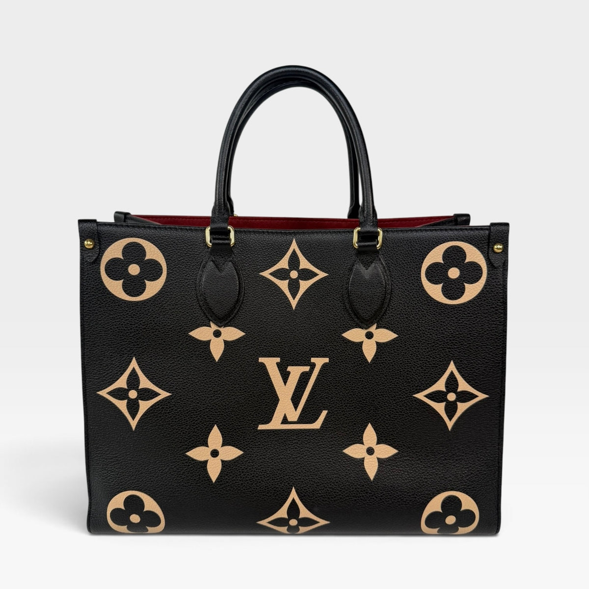 Louis Vuitton On The Go MM Tote In Black & Beige Leather With Gold Hardware. 100% authentic and preloved in excellent condition