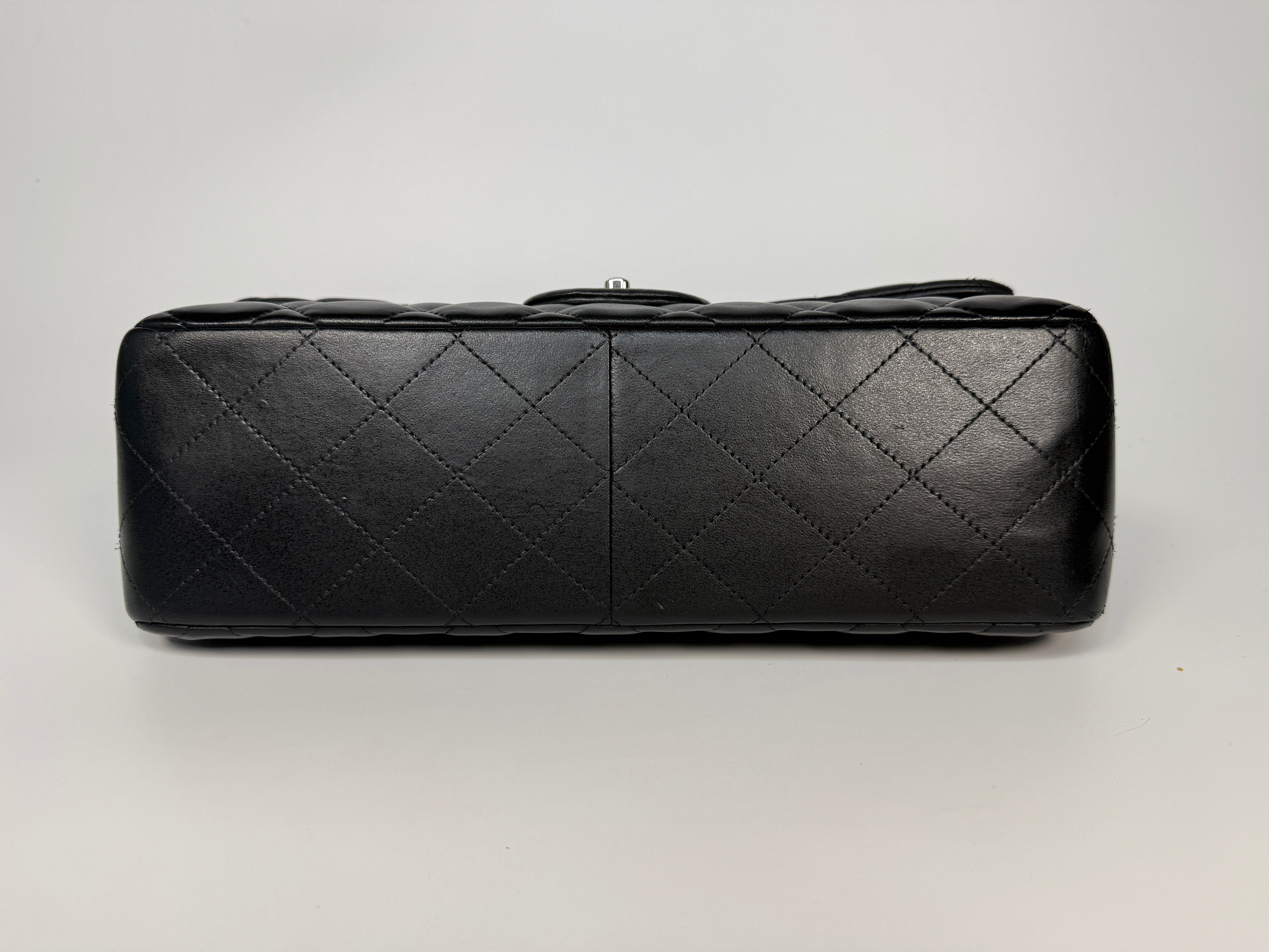 Authentic and preloved Chanel Jumbo Classic Flap Bag In Black Lambskin Leather With Silver hardware. Very Good condition. 100% Authenticity guarantee 