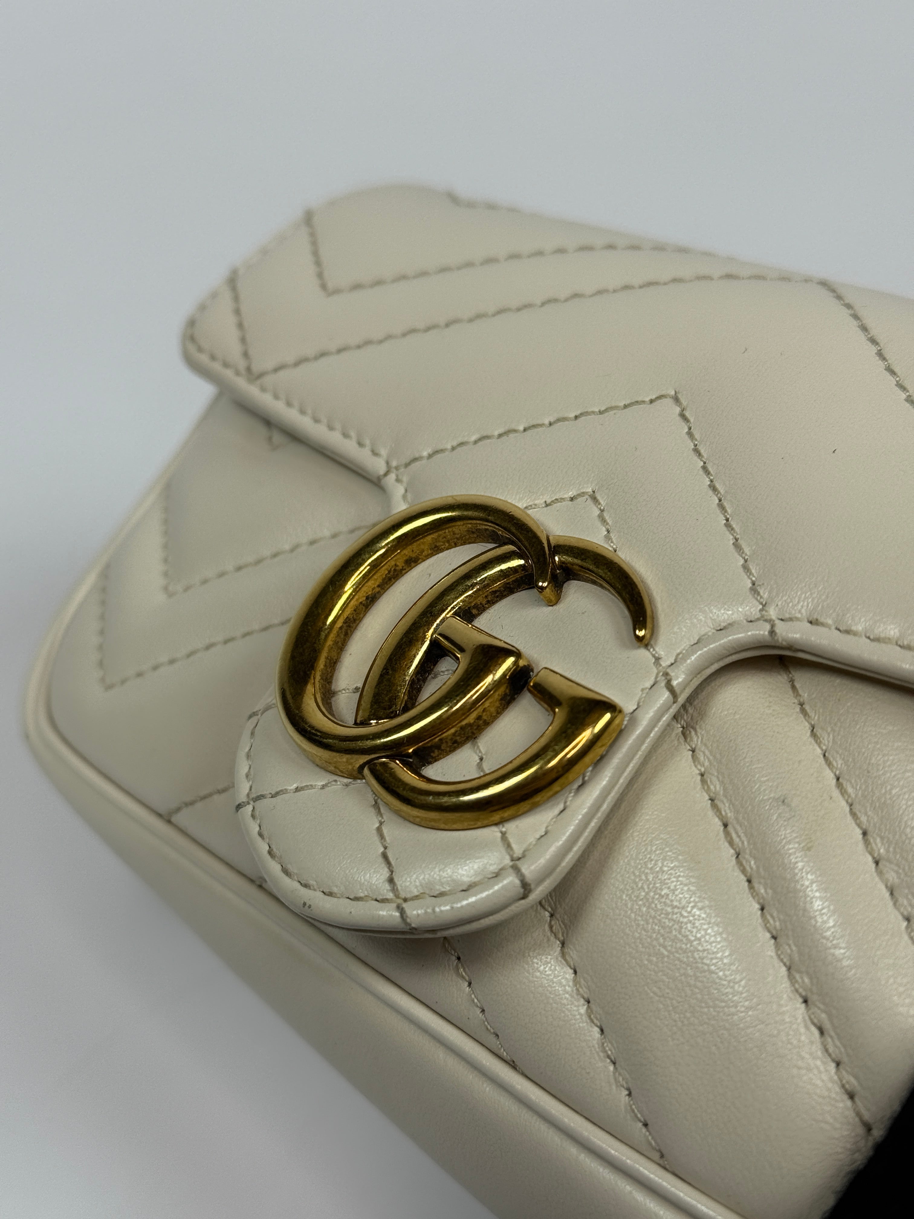 Gucci Marmont White  Matelassé Super Mini Bag With Gold Hardware In Excellent pre loved condition. Authentic and preloved