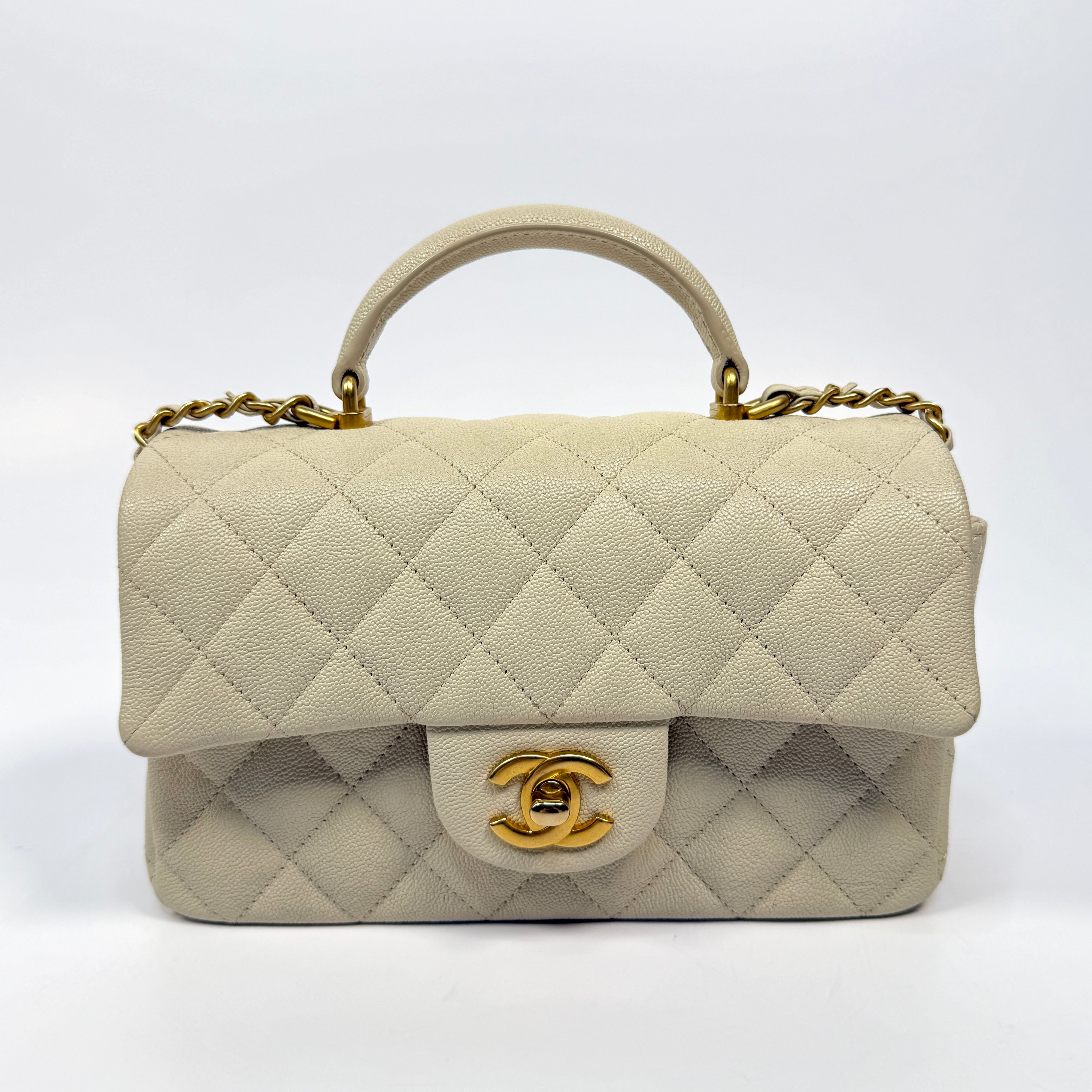 Chanel Mini Rectangle Top Handle In Ecru Caviar With Gold hardware, authentic and preloved in excellent condition