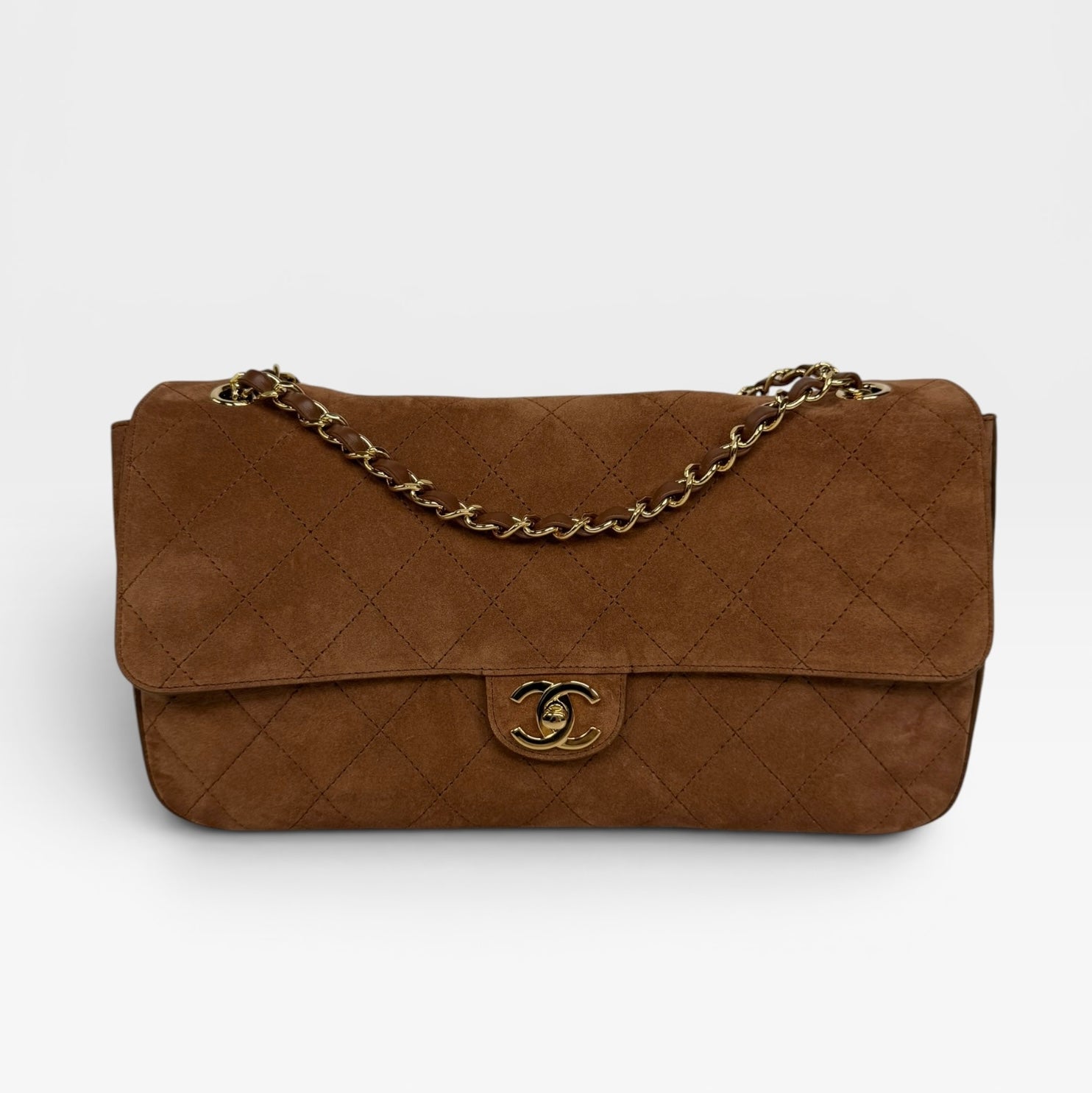Chanel Maxi Flap In Tan Suede With Gold Hardware. Authentic and preloved in new and unused condition.