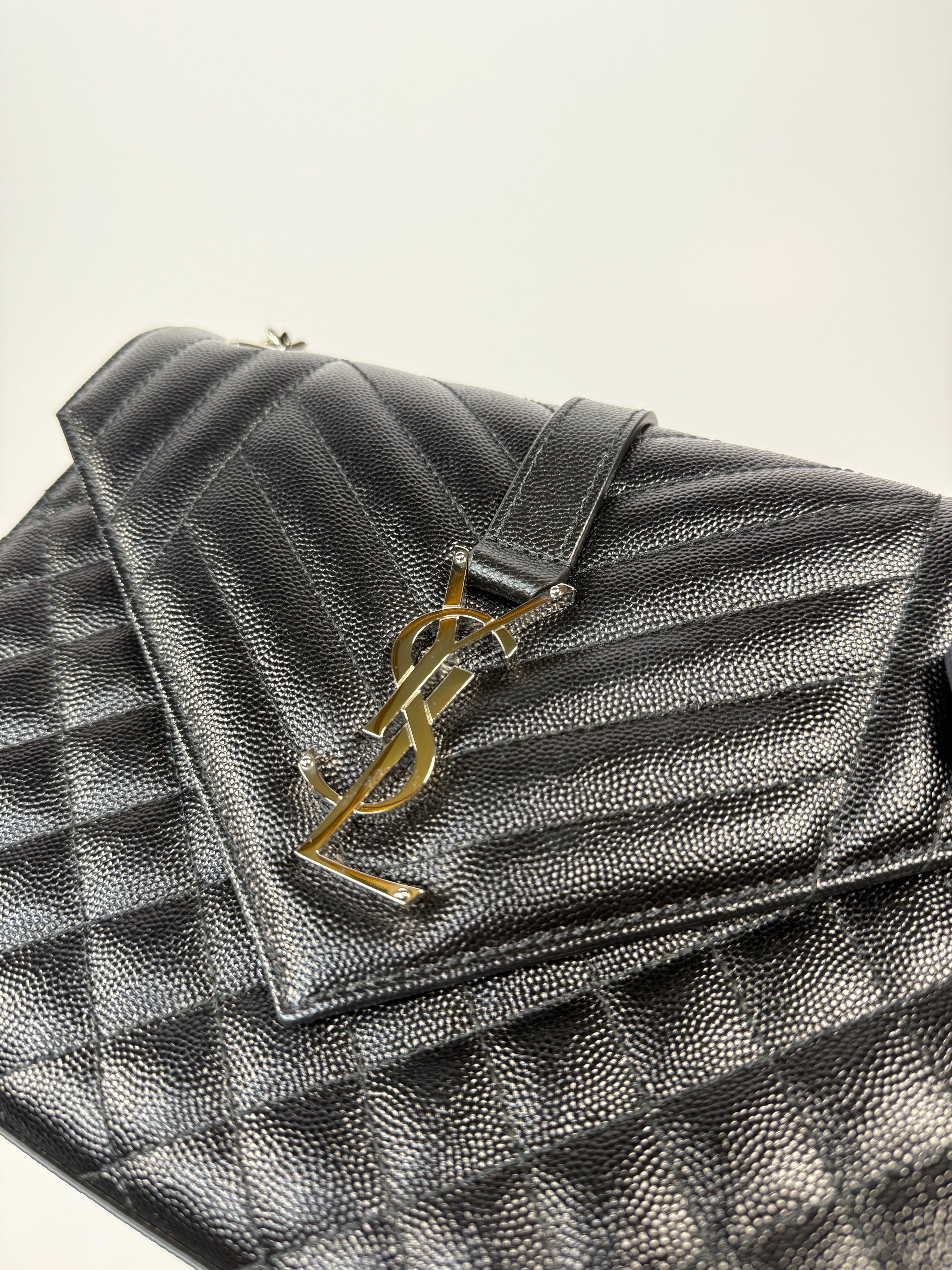 Saint Laurent Medium Envelope Bag In Blacked Grained Leather With Silver Hardware. Authentic and preloved. Excellent Condition