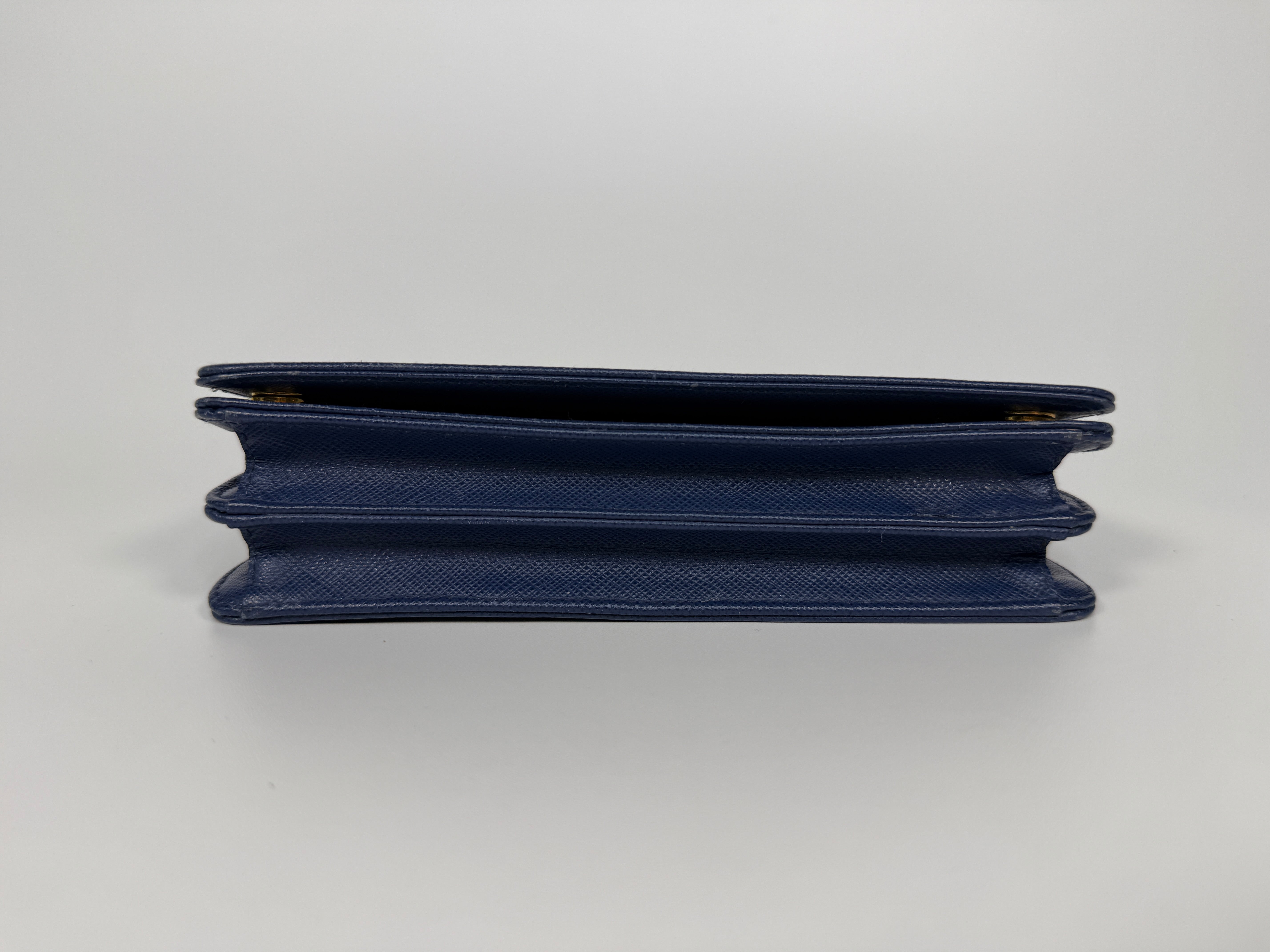 Authentic and preloved Prada Wallet Chain Bag In Blue Saffiano Leather With Gold Hardware. Very Good condition. 100% Authenticity guarantee 