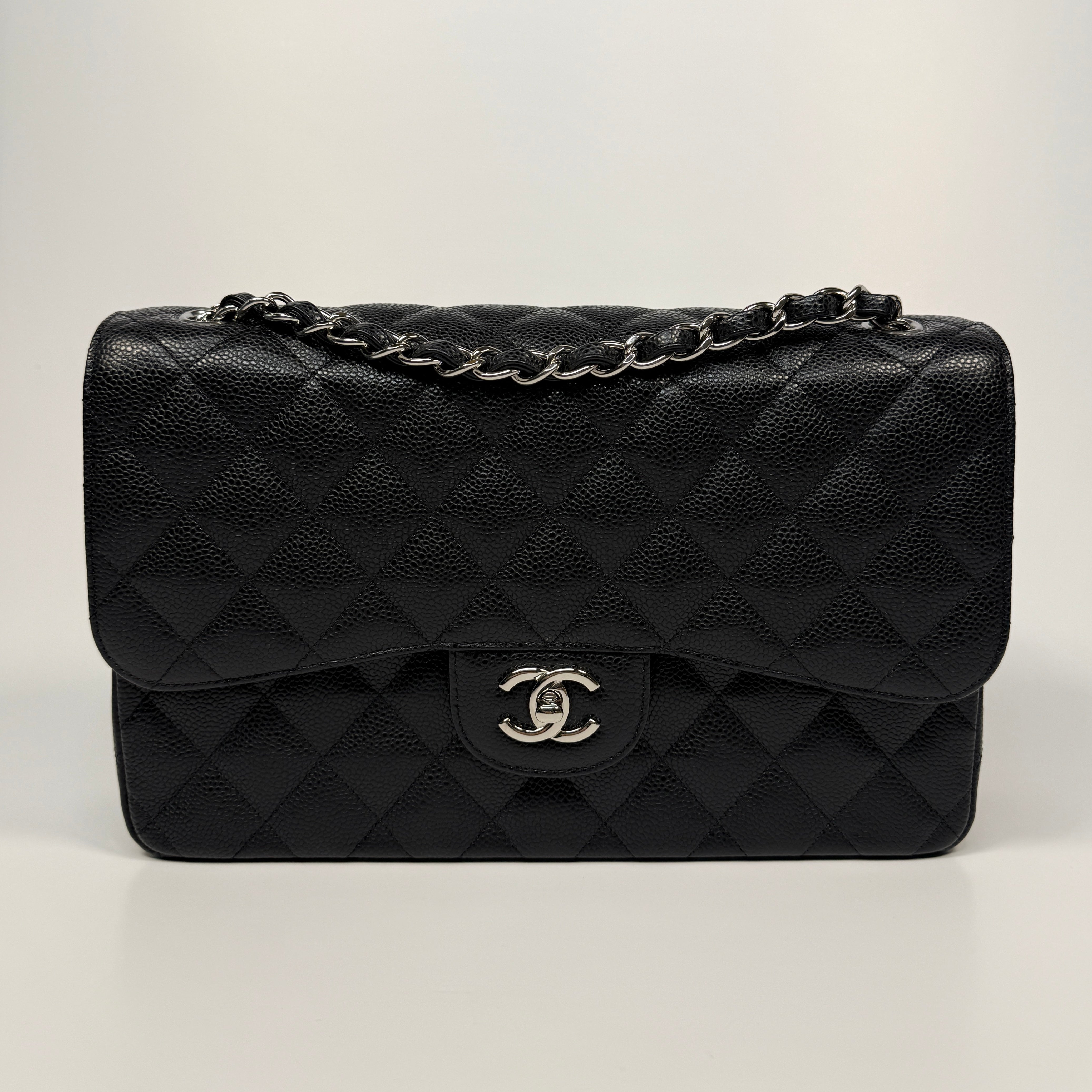 Chanel Classic Jumbo Flap Bag In Black Caviar Leather With Silver Hardware. Authentic and preloved. Excellent condition.