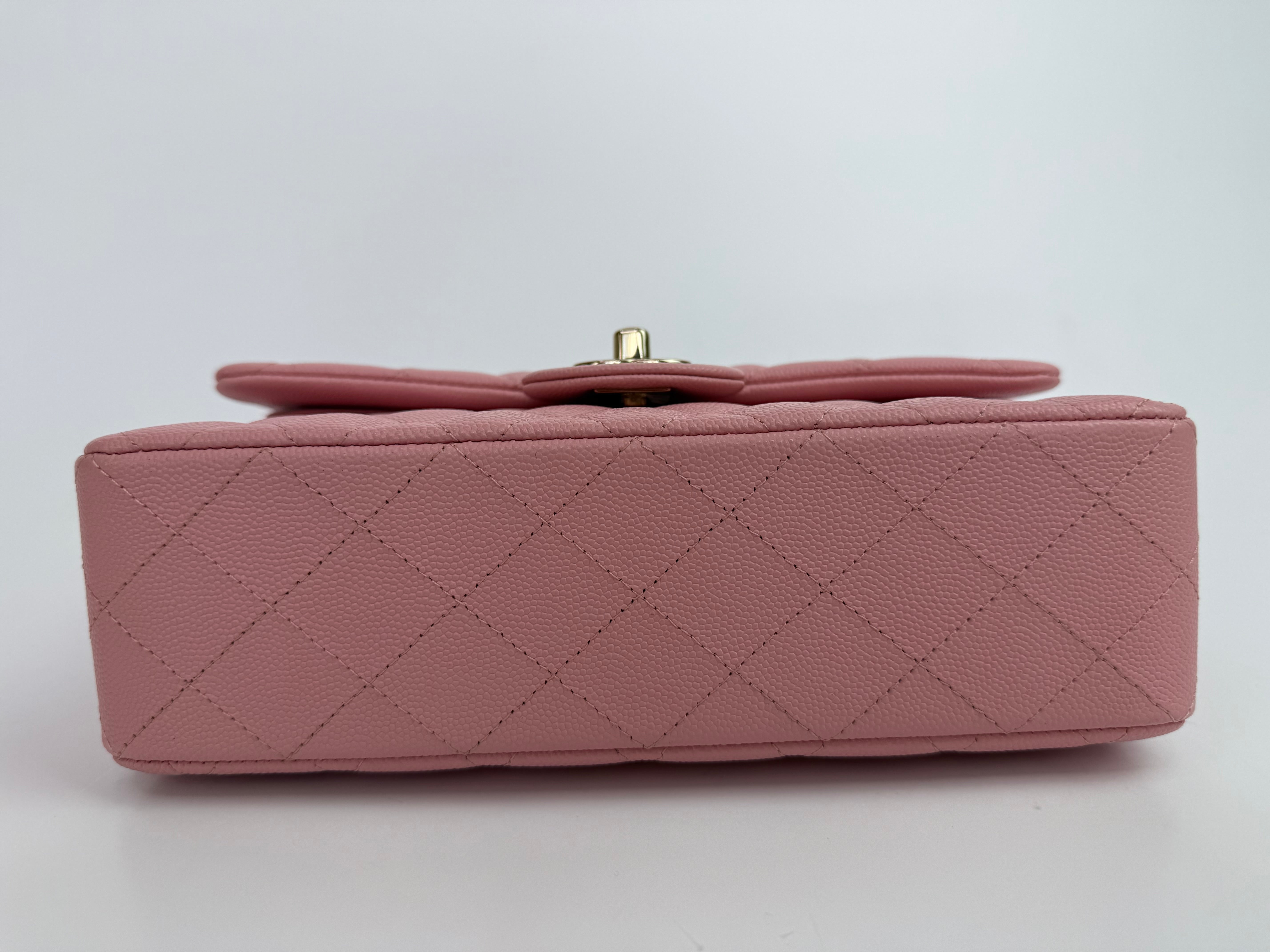 Authentic pre-loved Chanel Small Classic Double Flap In Pink Caviar Leather With Gold Hardware. 