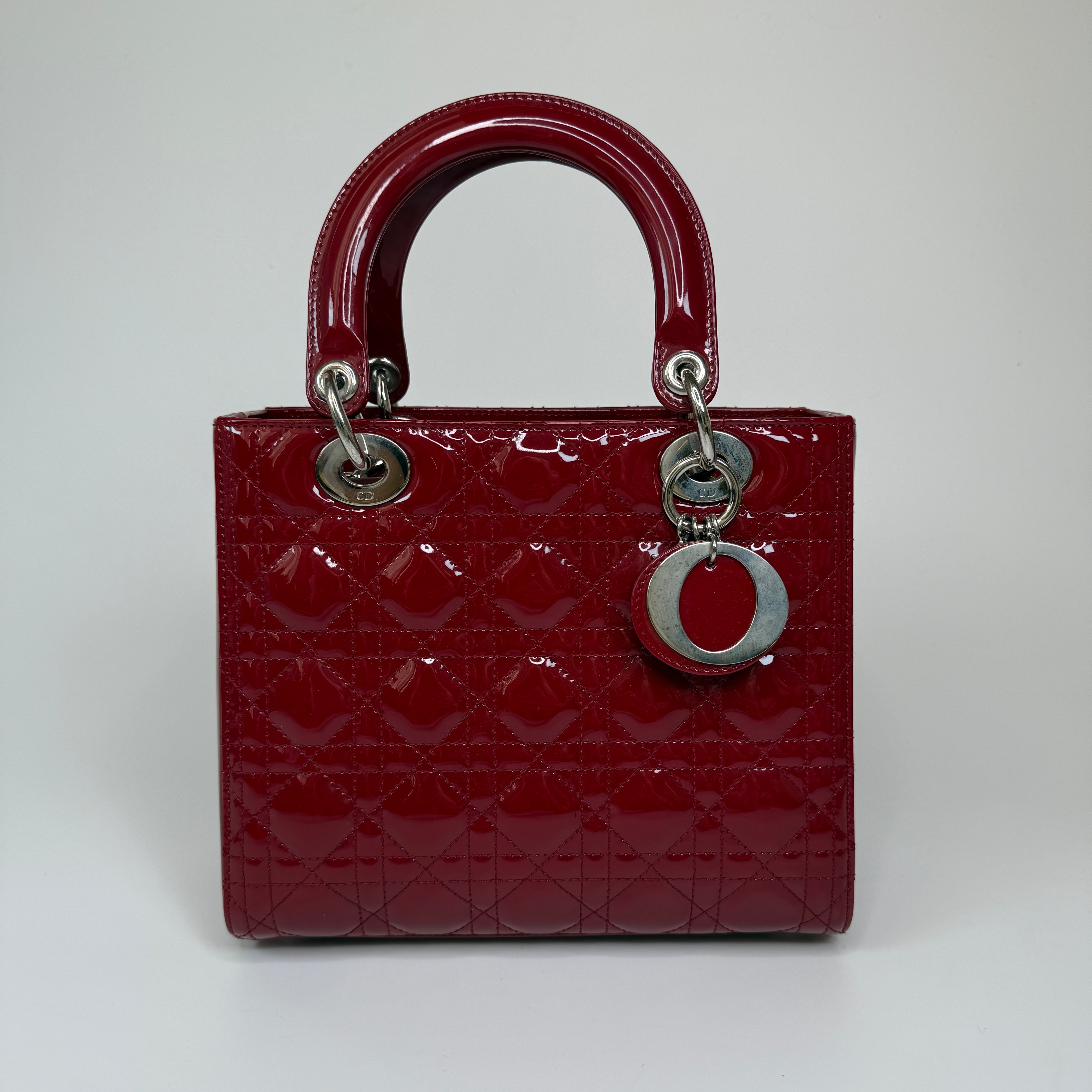 Christian Dior Medium Lady Dior In Patent Red Leather With Silver Hardware Authentic and preloved. 100% Authenticity Guarantee 