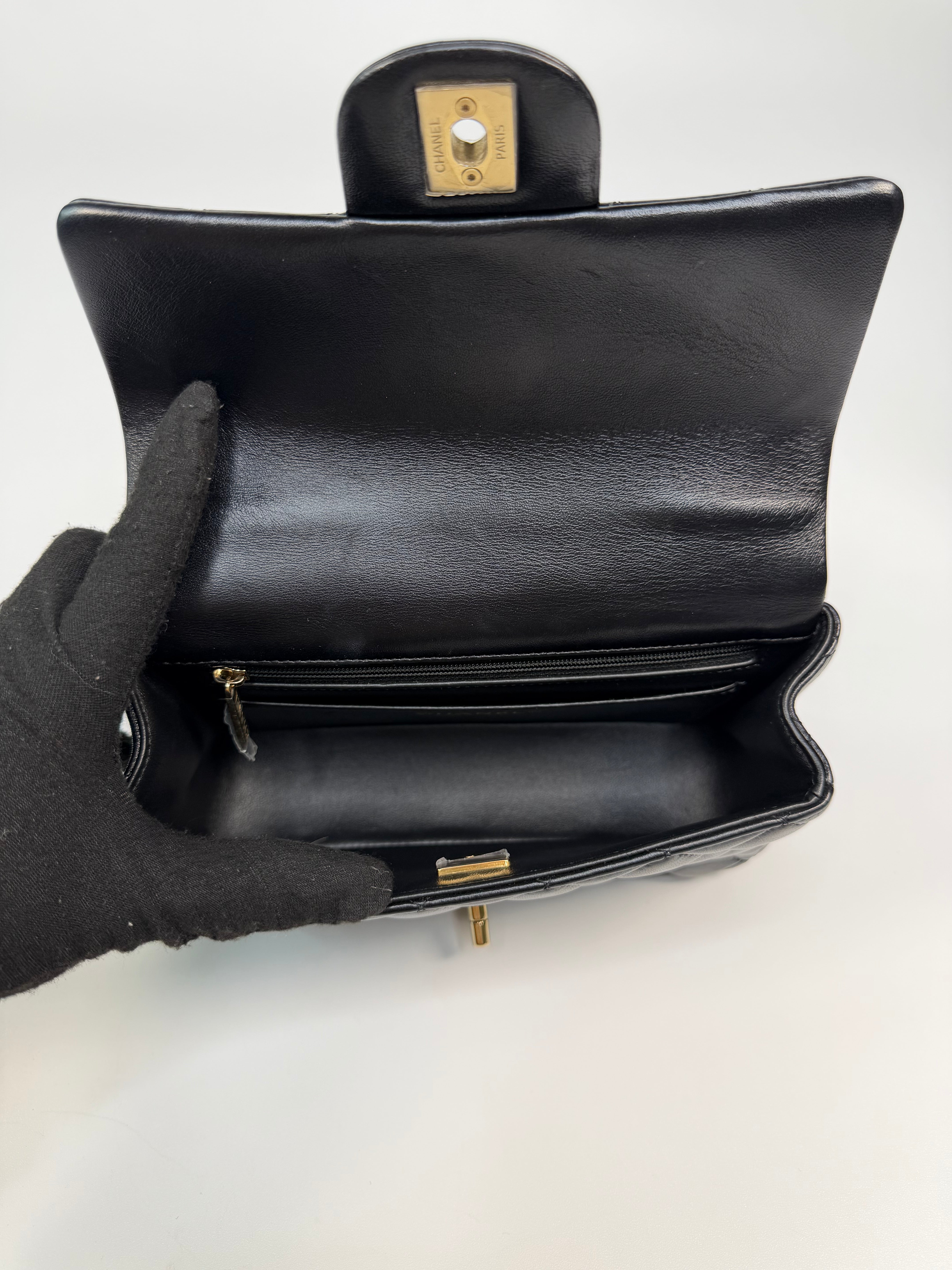 Chanel Mini Rectangle Top Handle In Black Lambskin Leather With Pale Gold Hardware. Authentic and preloved in excellent condition.