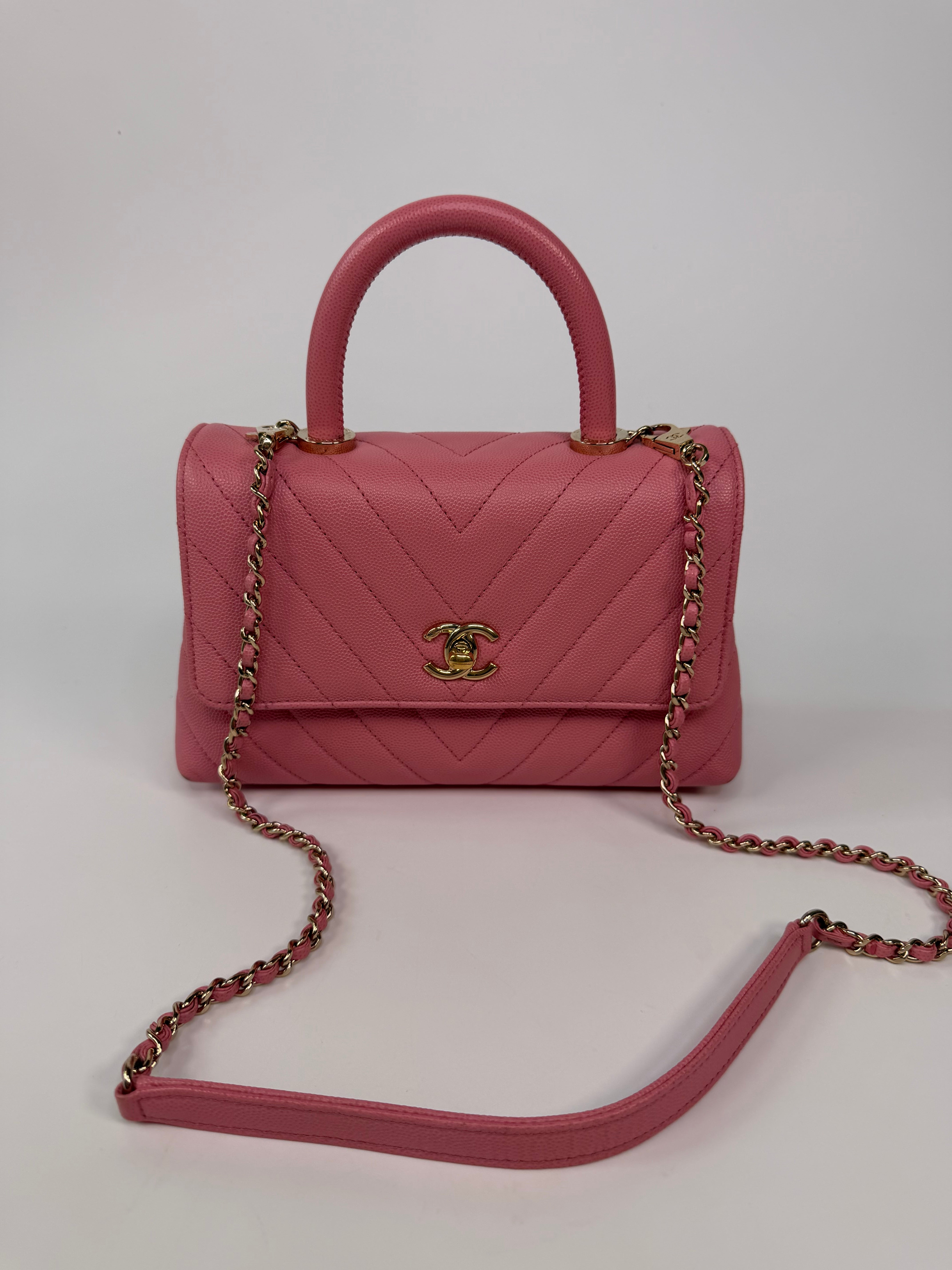 Chanel Small Chevron Coco Top Handle In Pink Caviar With Gold Hardware. 100% authentic and preloved in very good condition.