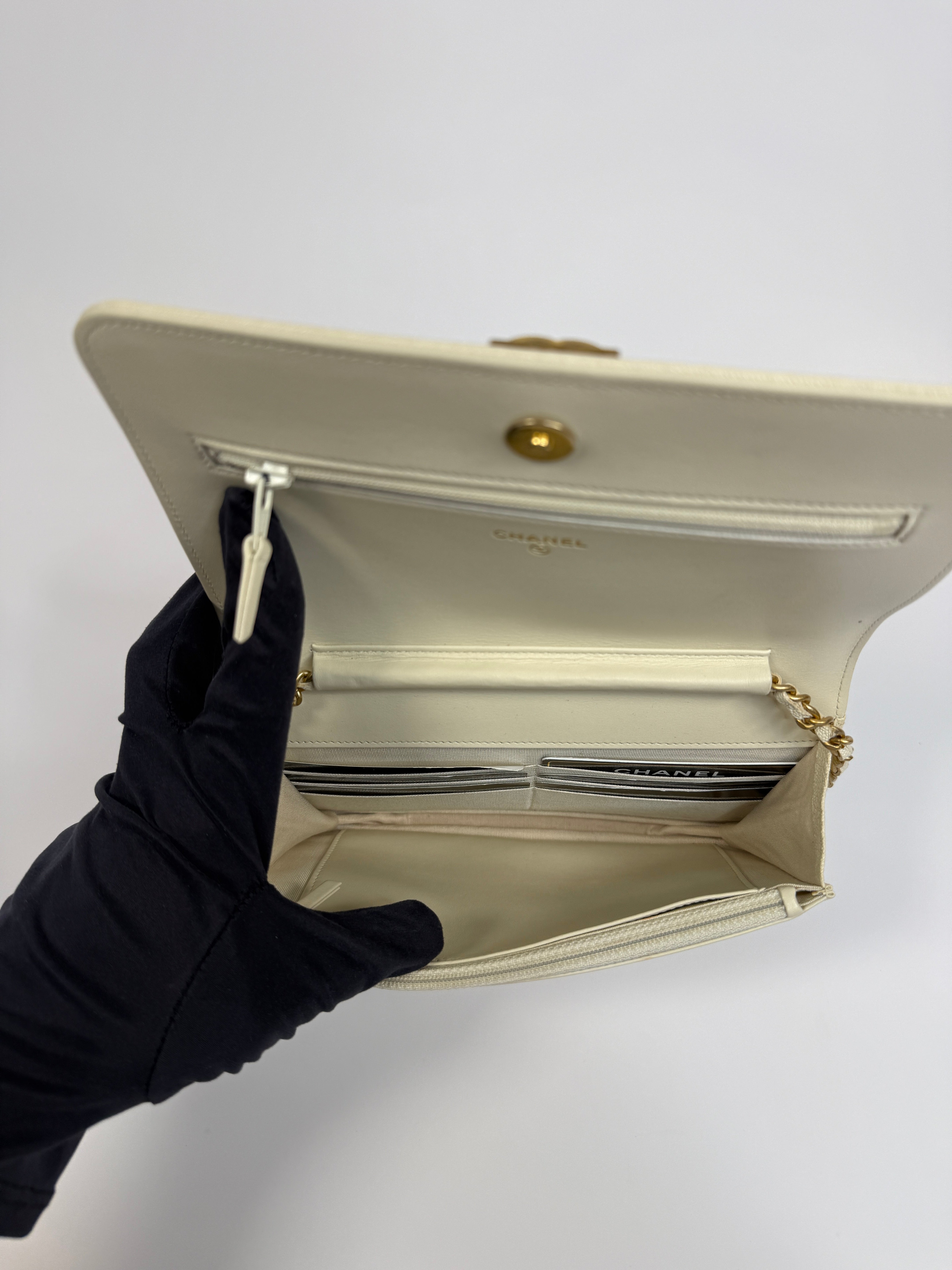 Authentic and pre loved Chanel Boy Wallet On Chain In White Caviar Leather With Gold Hardware. Excellent Condition