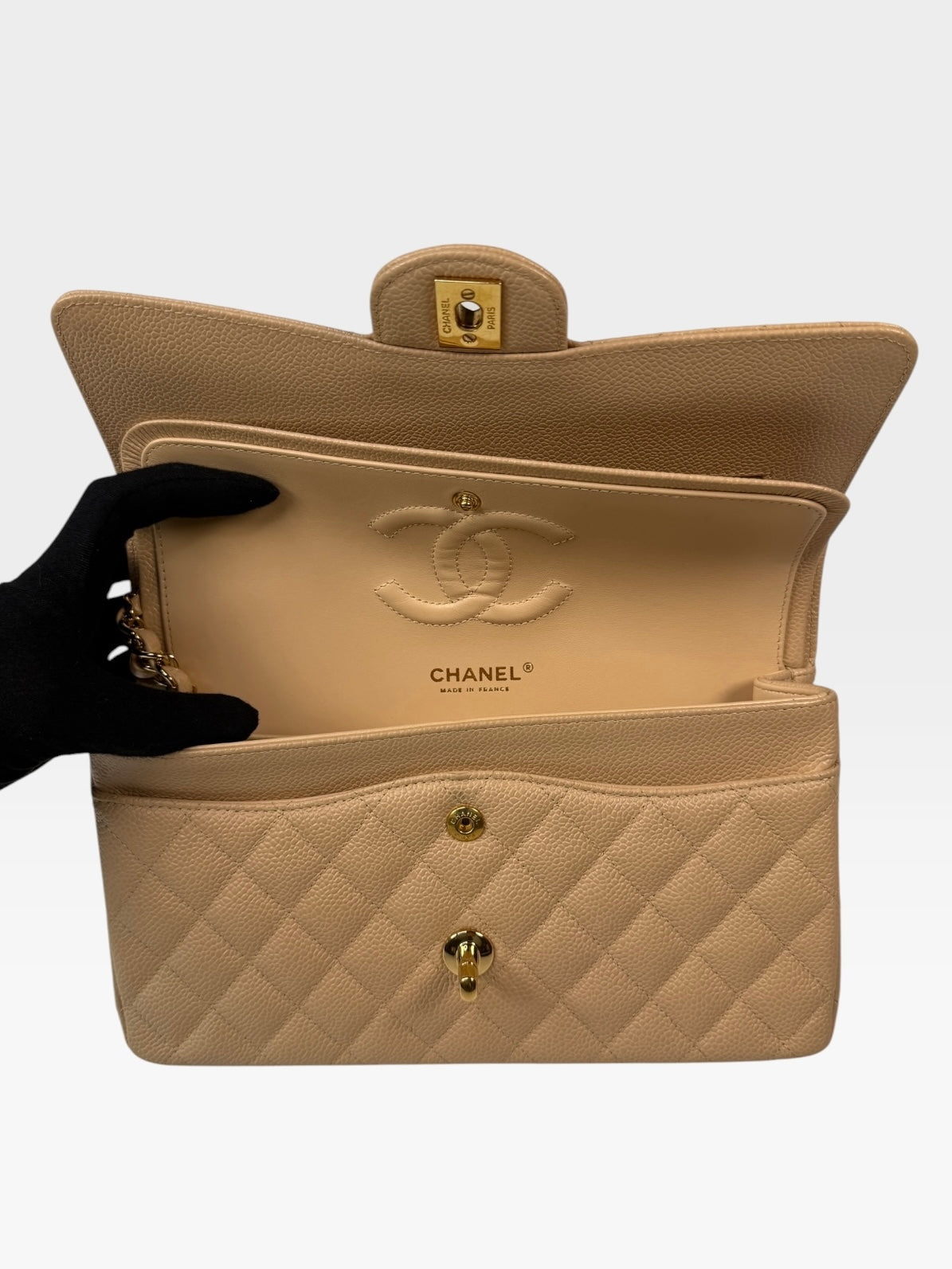 Chanel Medium Classic Flap In Beige Caviar Leather With Gold Hardware. 100% authentic and preloved in excellent condition