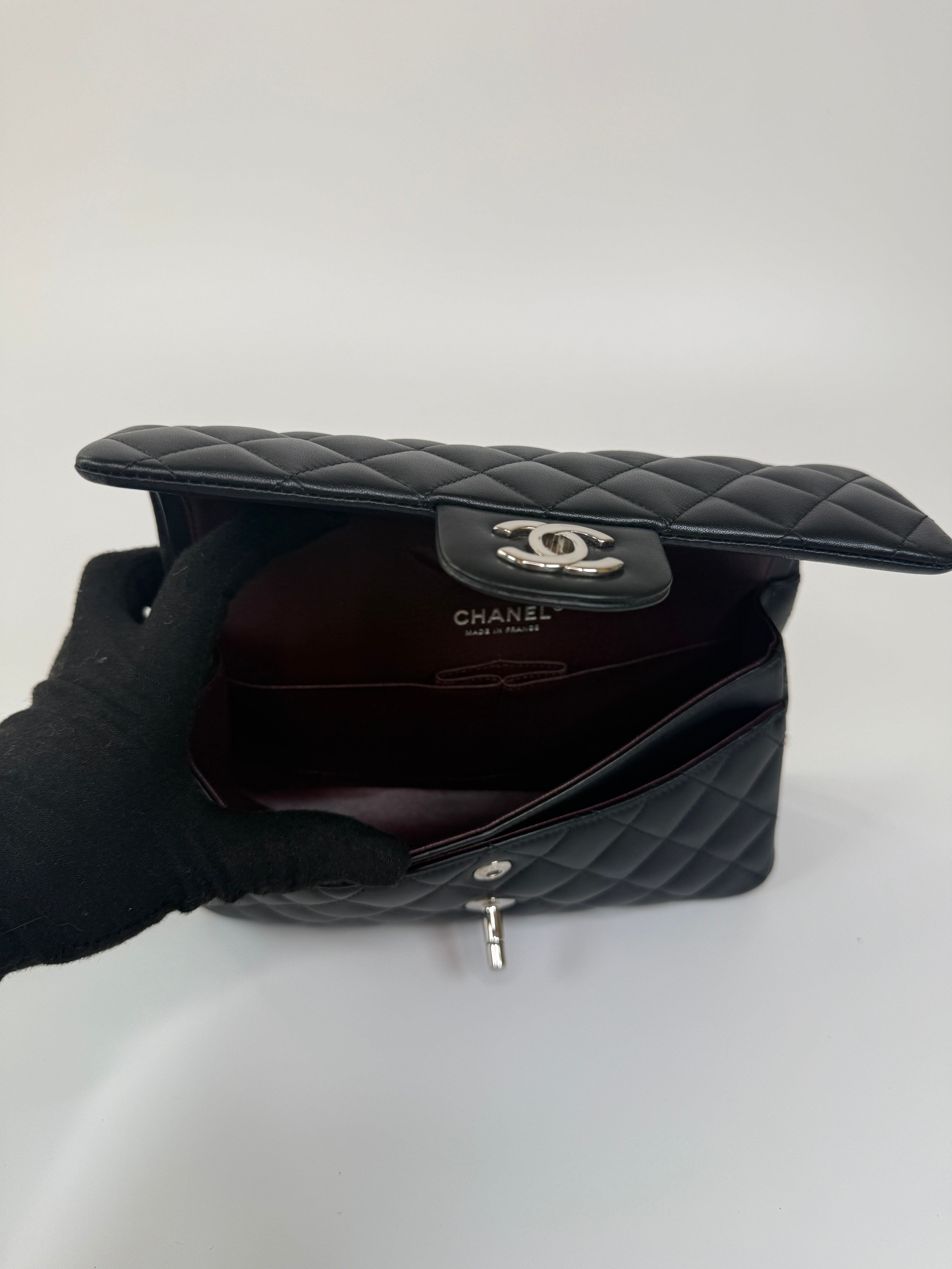 Chanel Small Classic Double Flap In Black Lambskin Leather With Silver Hardware Authentic and preloved in excellent condition. 100% Authenticity guarantee