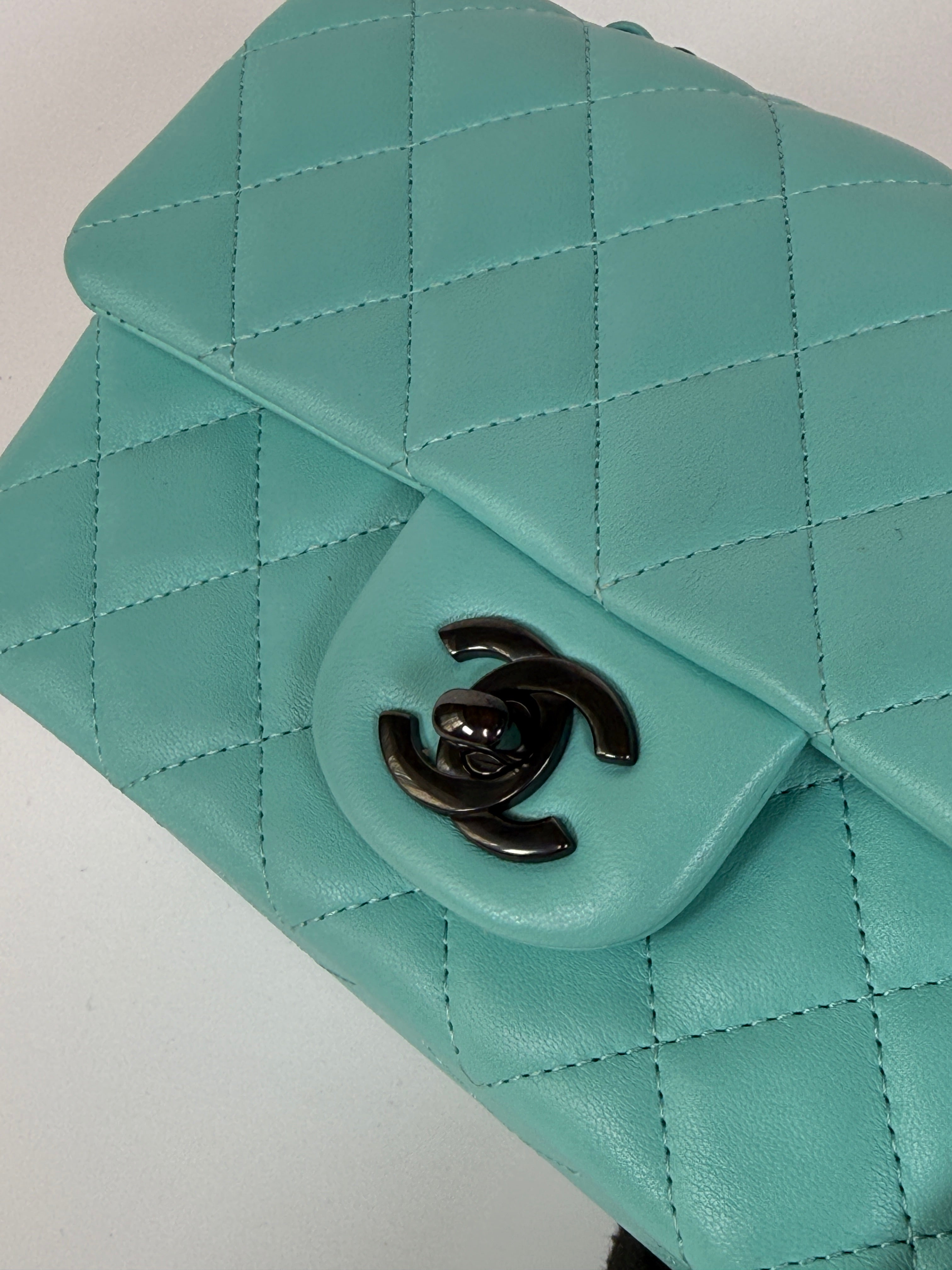 Authentic and preloved Chanel Mini Rectangle Flap Bag In Turquoise Lambskin Leather With Gunmetal Hardware In Excellent condition. Verified by Luxe Cheshire. 100% Authenticity Guarantee. 