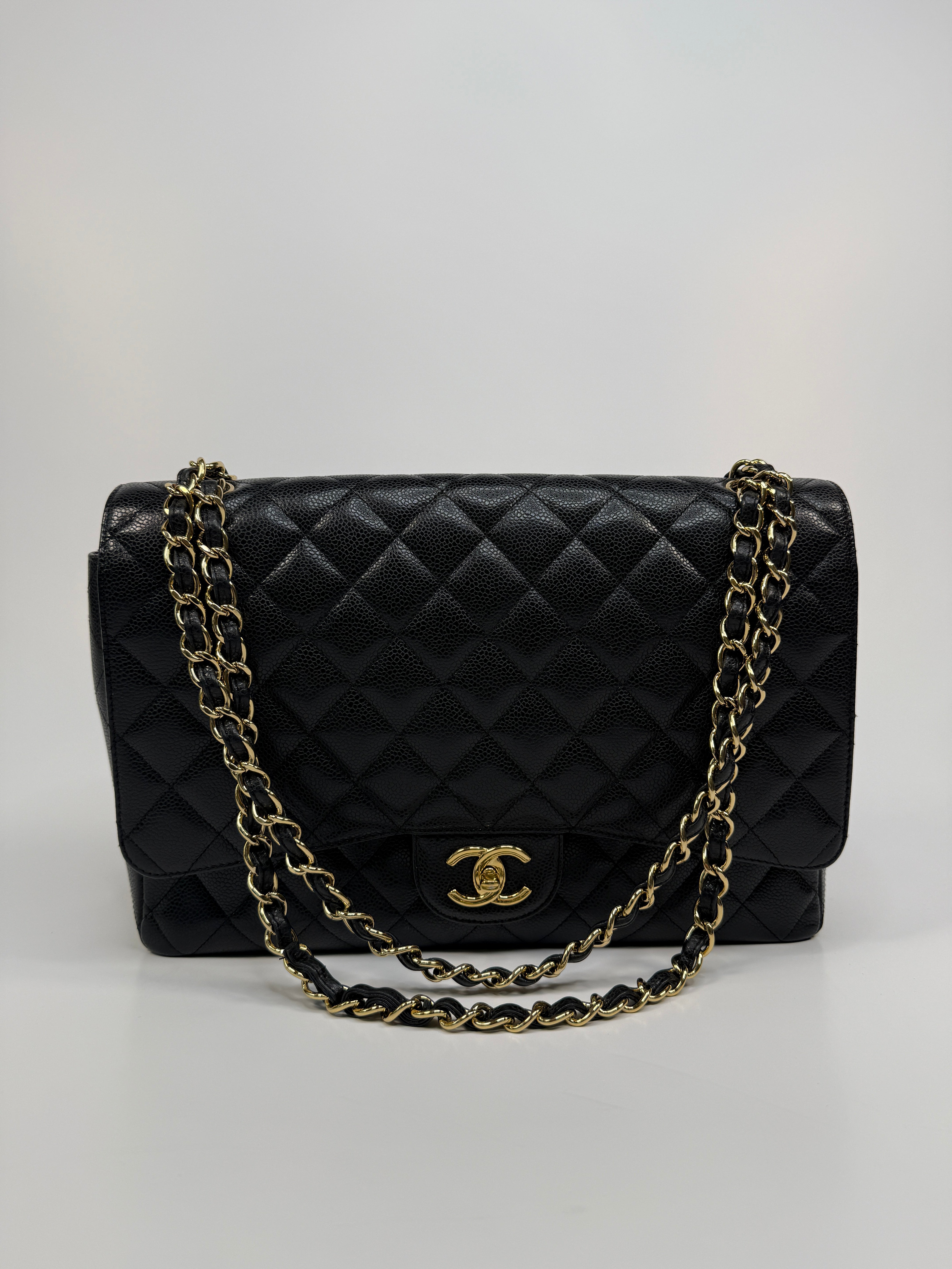 Chanel Maxi Classic Double Flap In Black Caviar Leather With Gold Hardware
Pre Loved & Authentic 