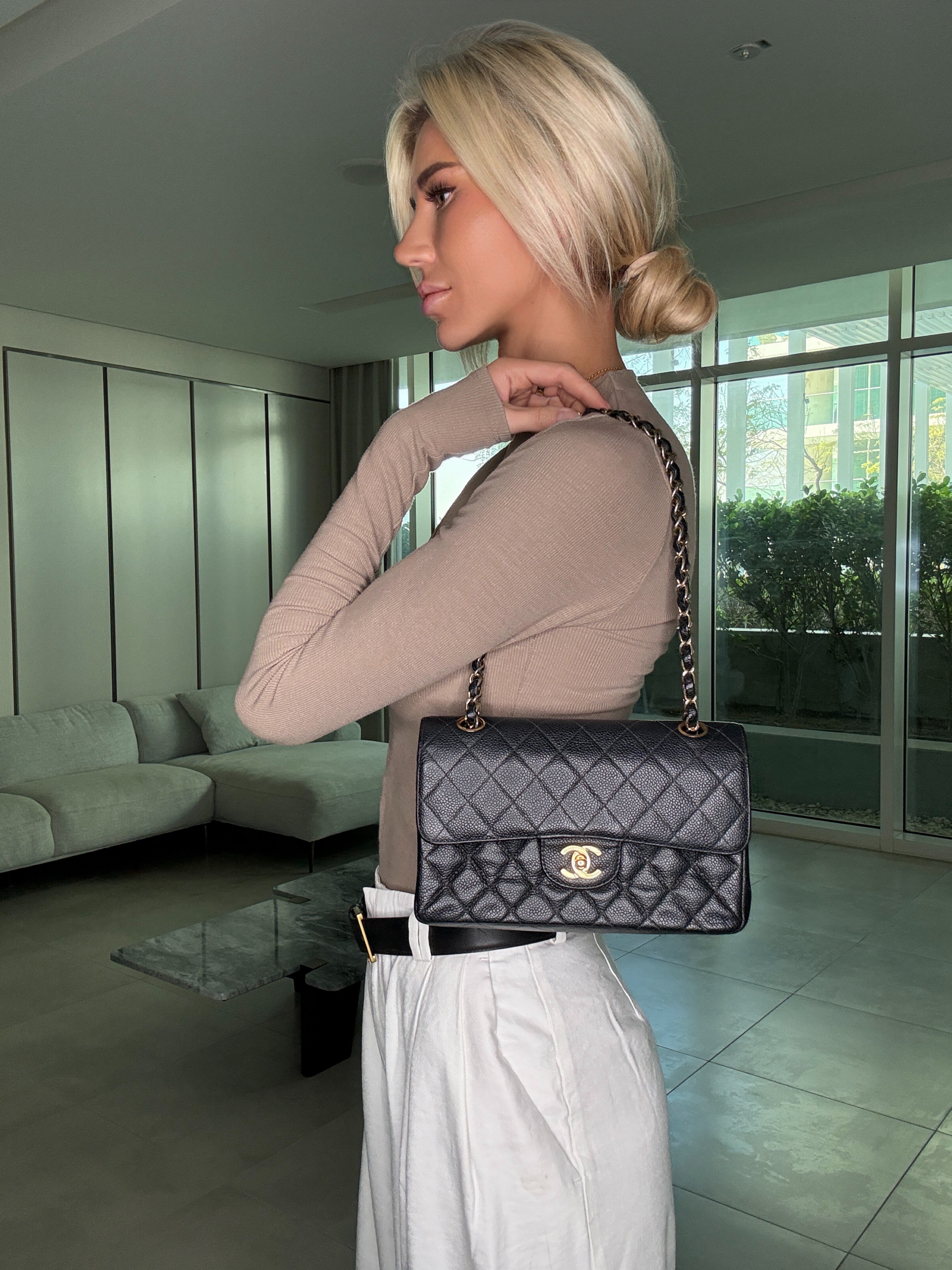 Authentic and preloved Chanel Small Vintage Classic Double Flap In Black Caviar Leather With Gold Hardware. Next day fully insured delivery. Verified by Luxe Cheshire. 100% Authenticity Guarantee. 