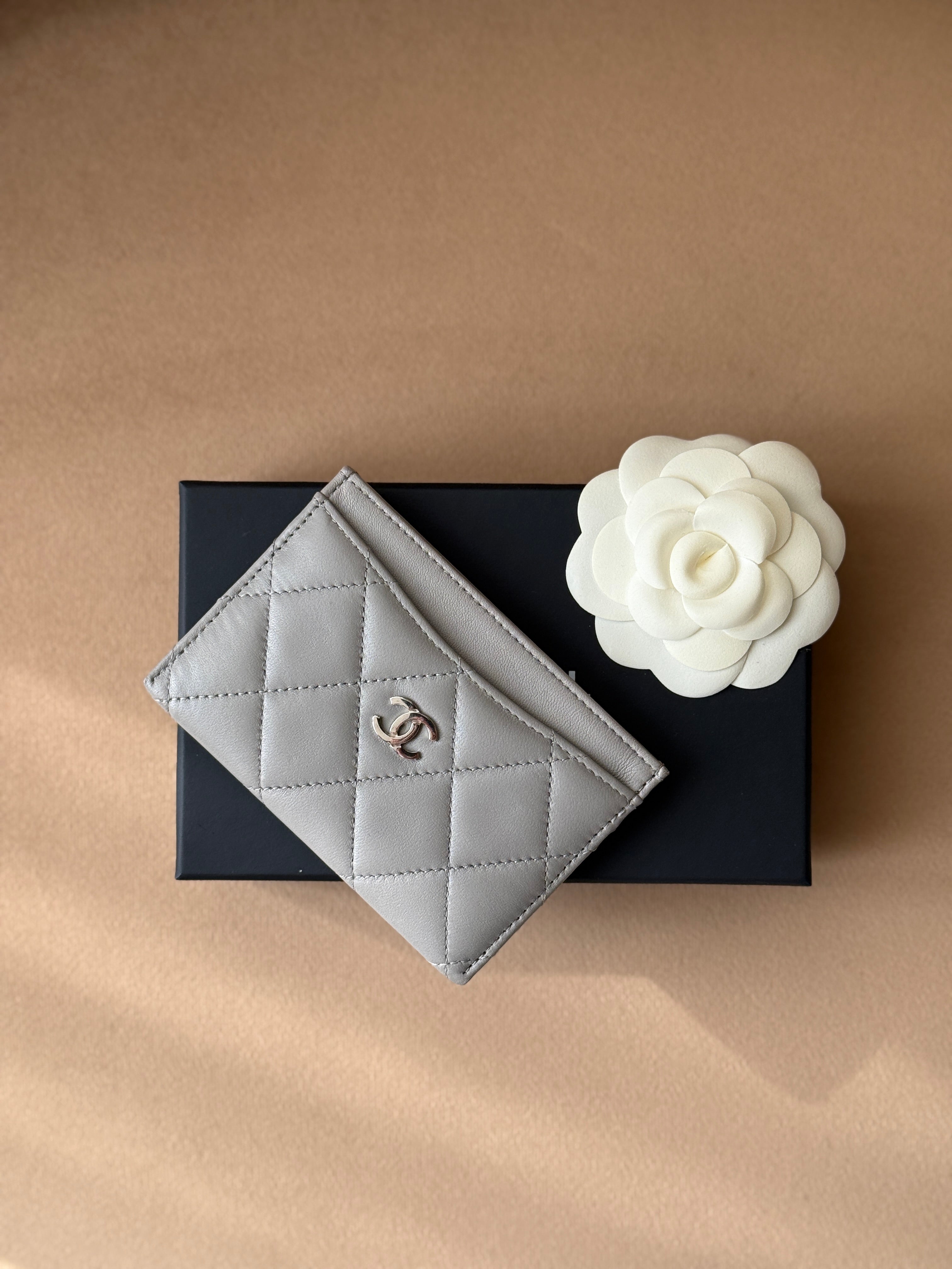 Authentic and pre loved Chanel Classic Card Holder In Grey Lambskin Leather With Silver hardware. Excellent Condition. 100% Authenticity guarantee. 