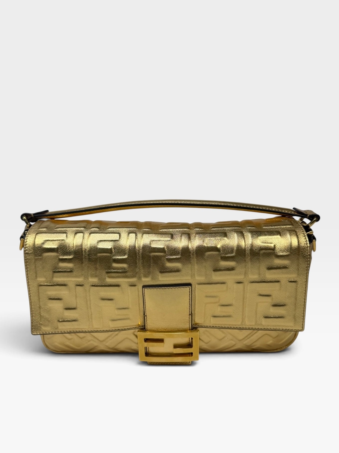 Fendi Large Baguette In Gold Leather Monogram With Gold Hardware. 100% authentic and preloved in excellent condition