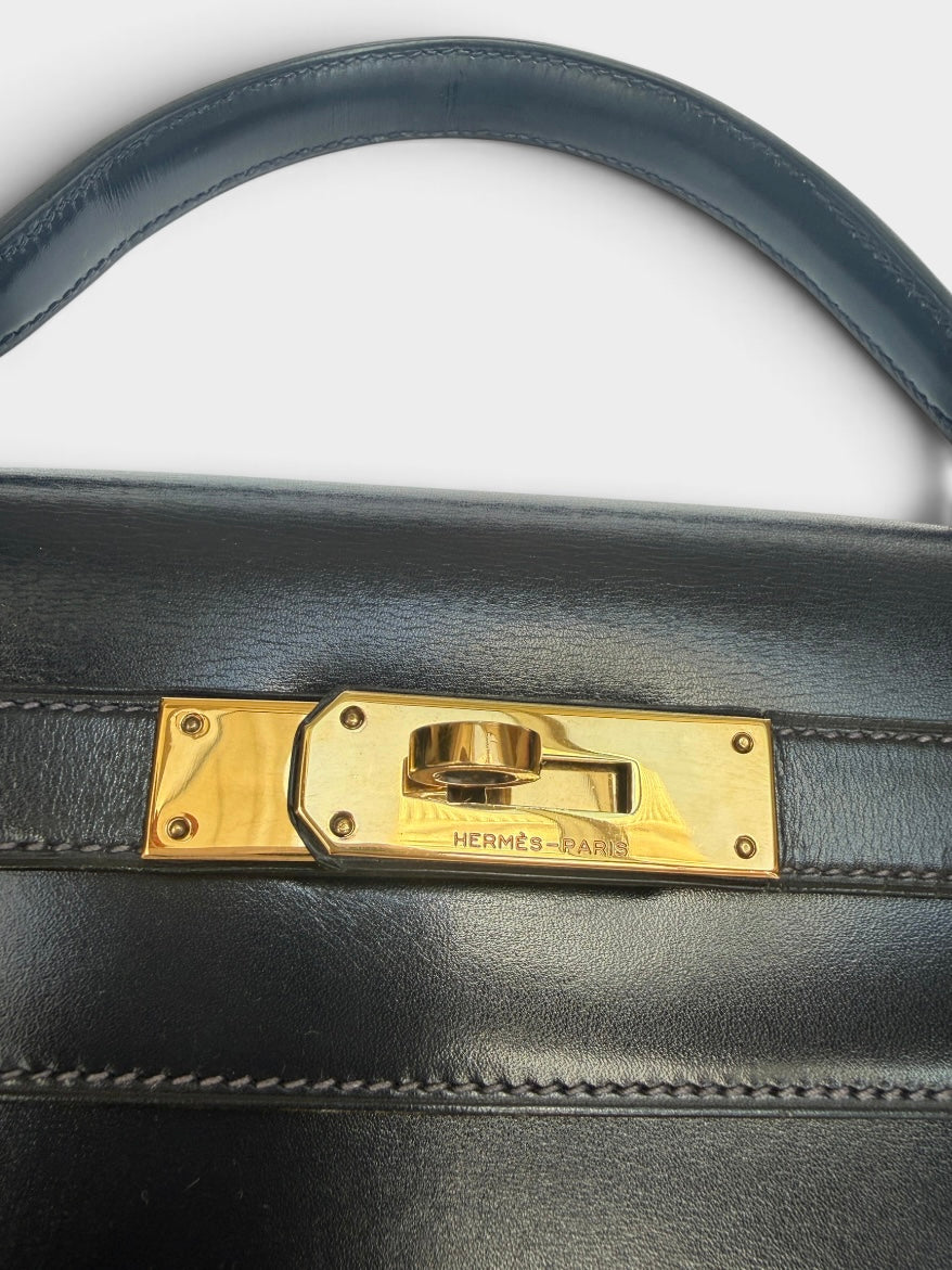 Hermès Vintage Kelly 28 In Navy Sellier Box Leather With Gold Hardware. 100% authentic and preloved in excellent condition.
