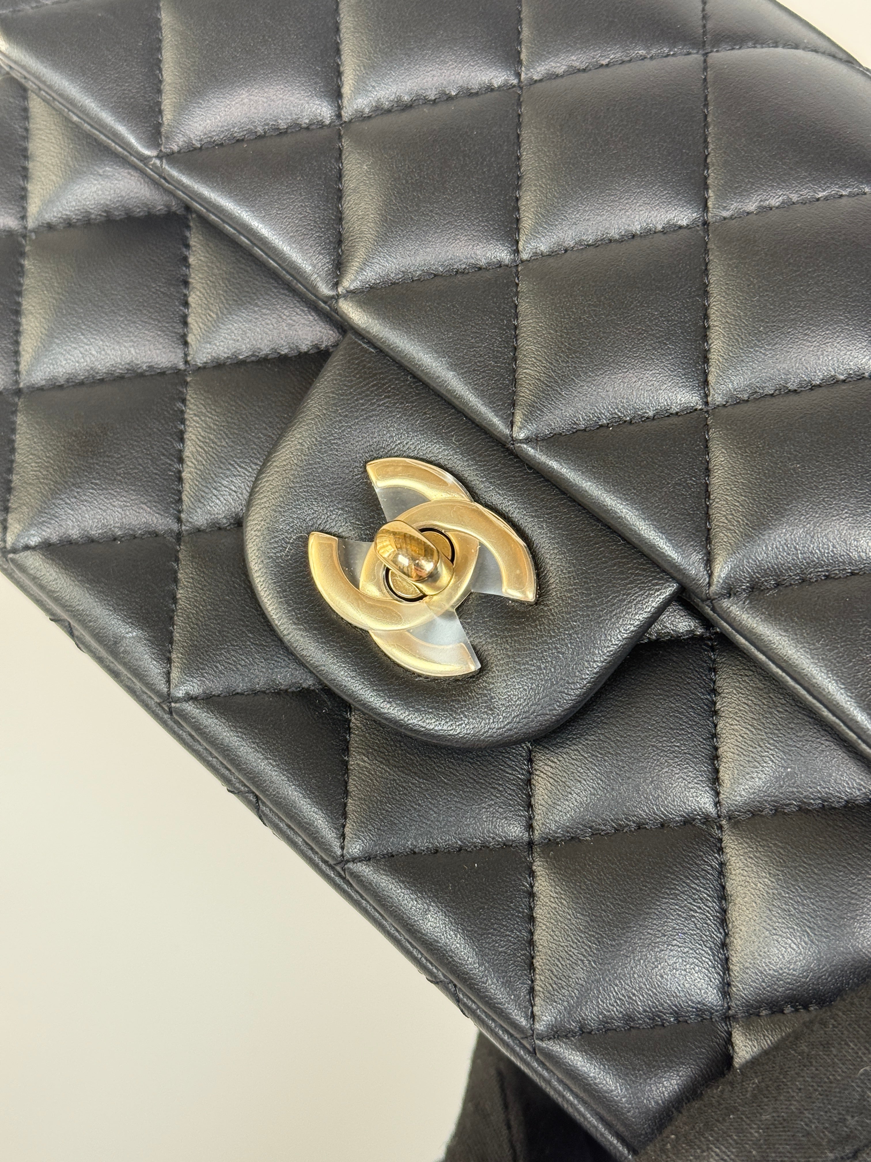 Authentic and preloved Chanel Mini Rectangle Top Handle Flap Bag In Black Lambskin With Gold hardware. Excellent Condition. 100% Authenticity guarantee 